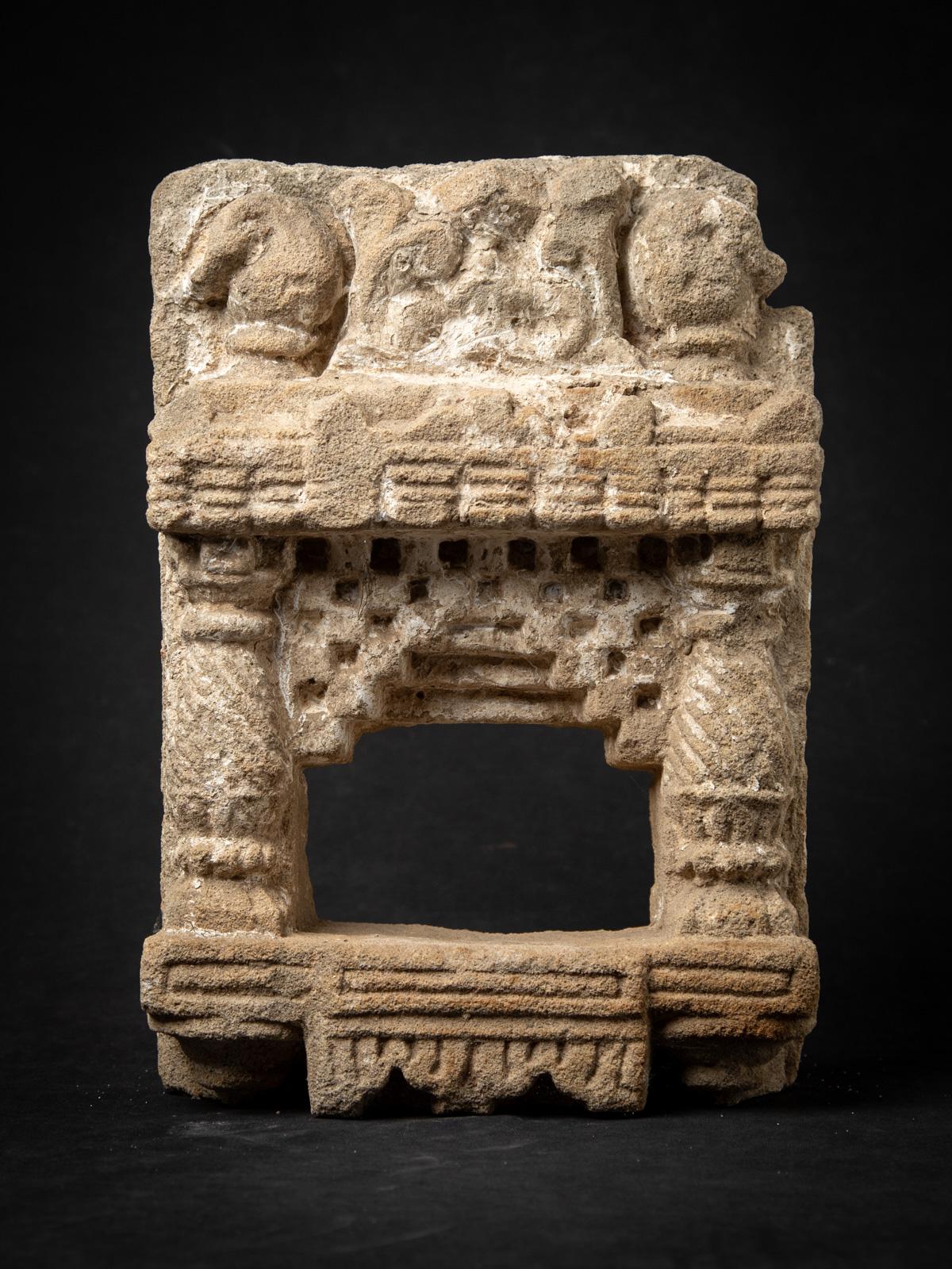 Presenting this antique sandstone Indian temple, a remarkable 19th-century artifact that embodies traditional Indian craftsmanship. Expertly carved from durable sandstone, it stands 37.7 cm high, 26.2 cm wide, and 9.2 cm deep, with a solid weight of
