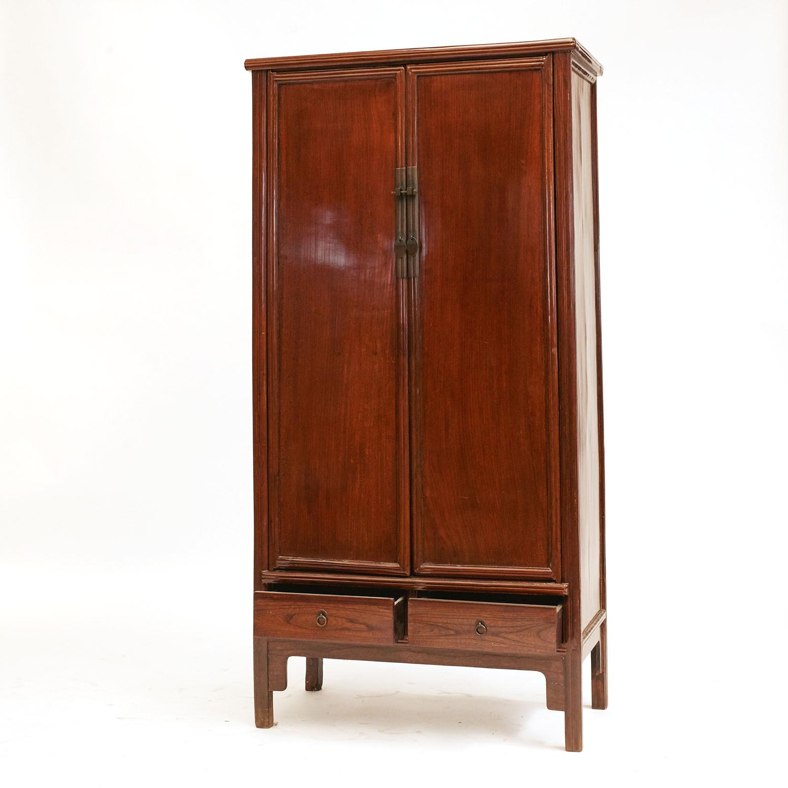 Cabinet, Ming style made in Jumo (Elm)  wood.
From Suzhou China, located close to Shanghai. Was formerly the largest city in Jiangsu province. Each panel made of one piece of wood. 