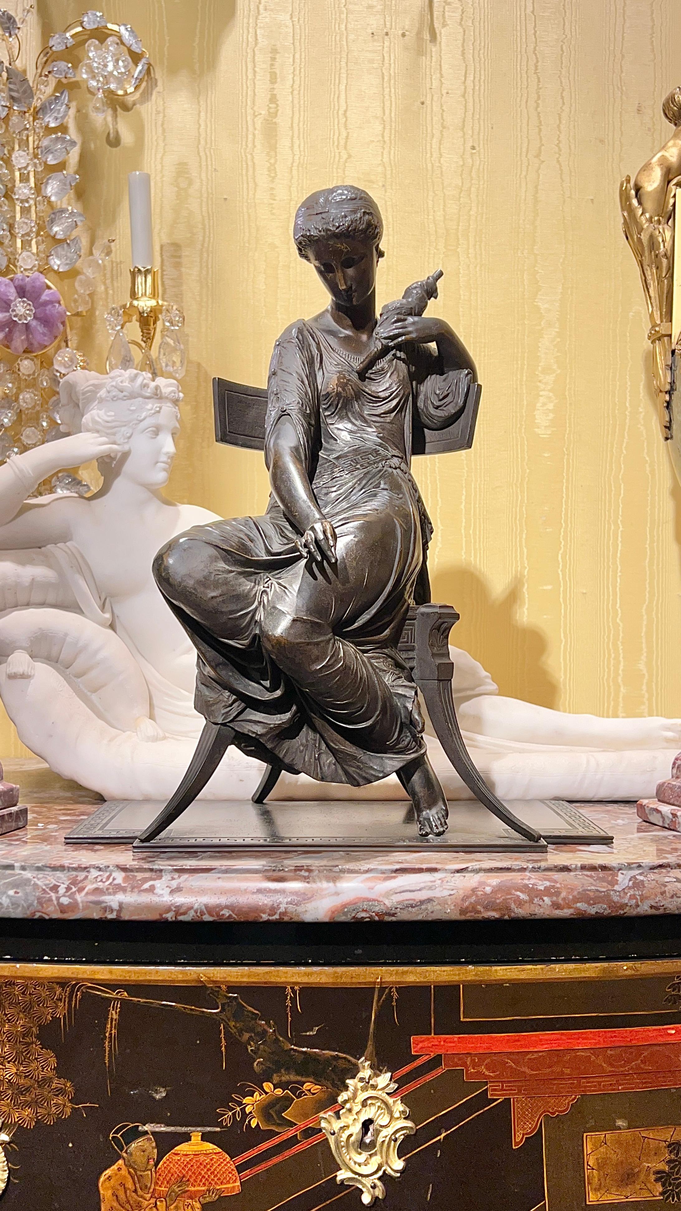 Antique finest quality (late 19th century) patinated bronze sculpture of a beautiful Greek seated on a Klismos chair and holding a spindle.  Apparently unsigned.
