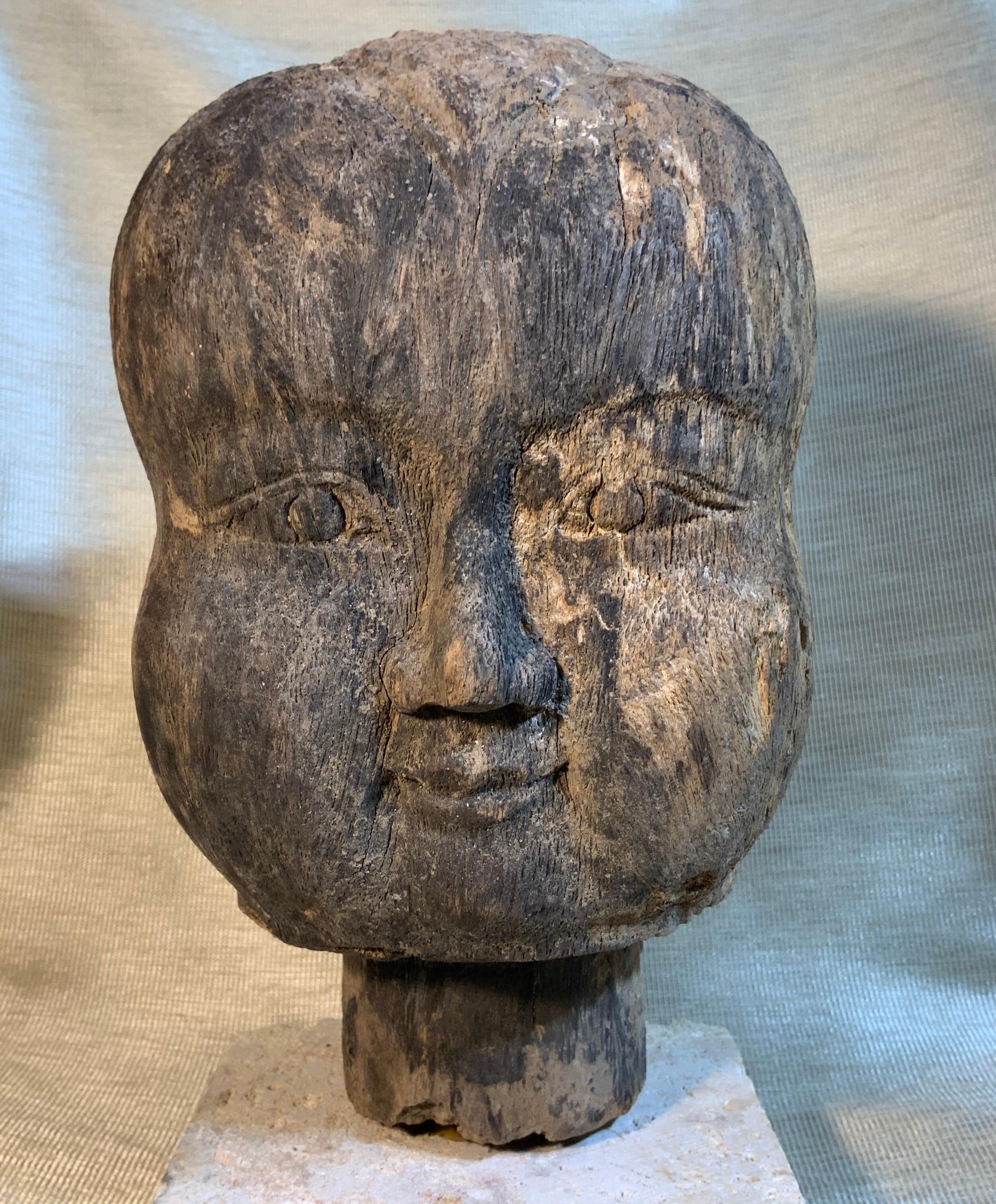 A beautiful 19th century Buddhist baby monk head, hand carved wood depicting the baby looking forward gracefully with like Mona Lisa kind smile?. Exceptional Buddhist antiquity That can make your day, whenever you look at it.
Professionally mounted