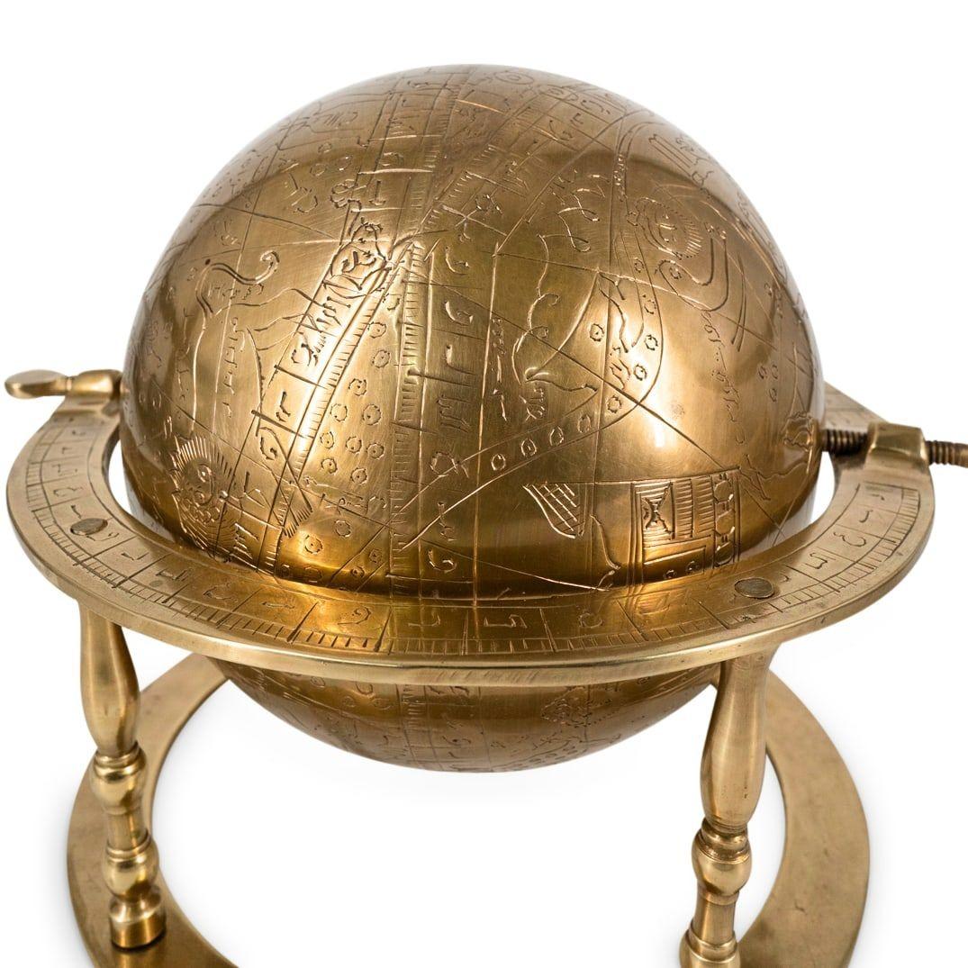 19 century  Persian celestial globe astrolabe mounted on axle, decorated with bands, Farsi inscriptions and animals, raised on four baluster shaped legs with secondary ring raised on bun feet.  
