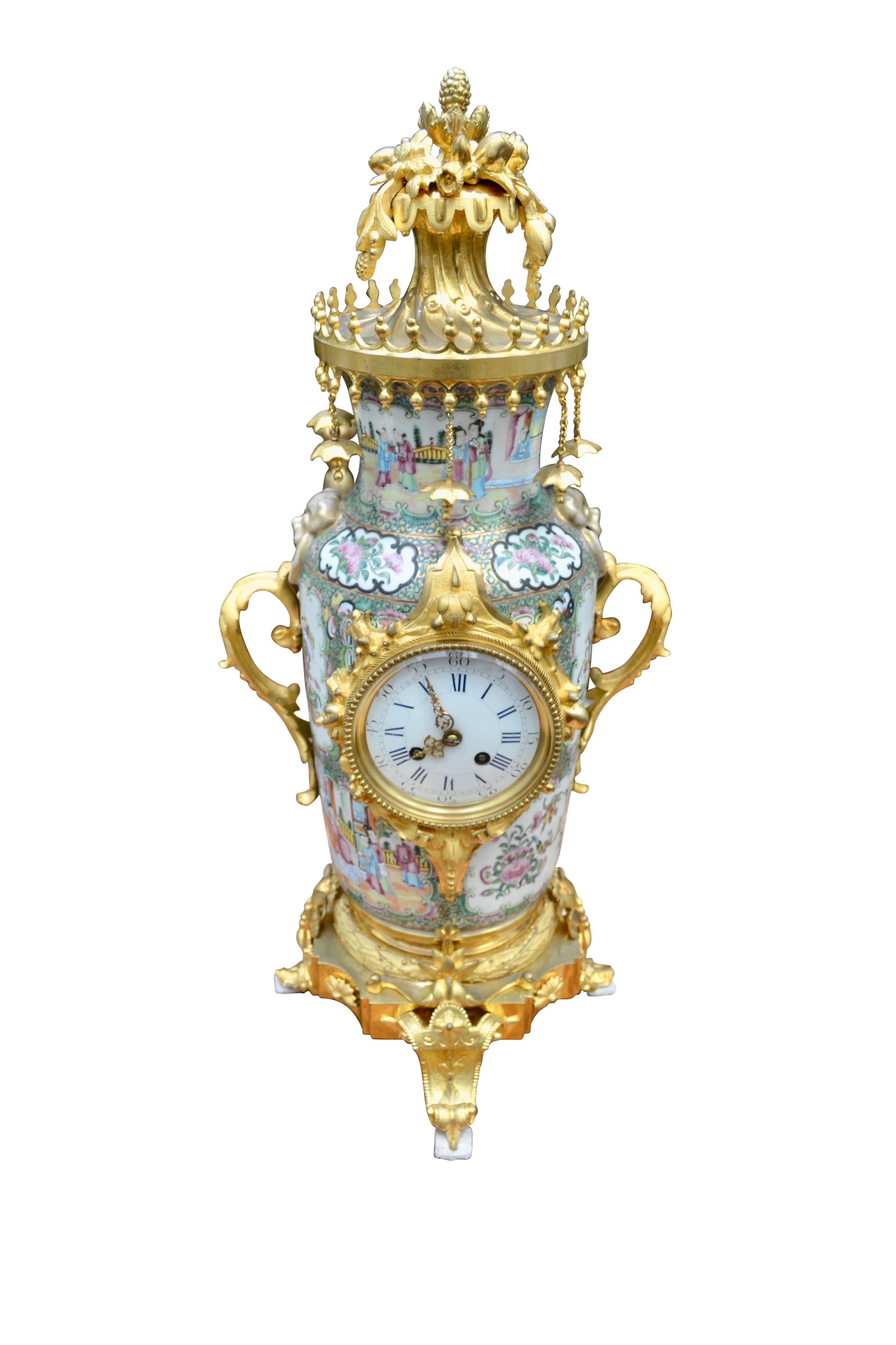 A fine and rare large scale Chinese porcelain and gilt bronze mantle clock , the body of the in hand painted rose medallion design, (famille rose), and richly embellished with finely chased and gilded bronze mounts. The porvelain pis painted with