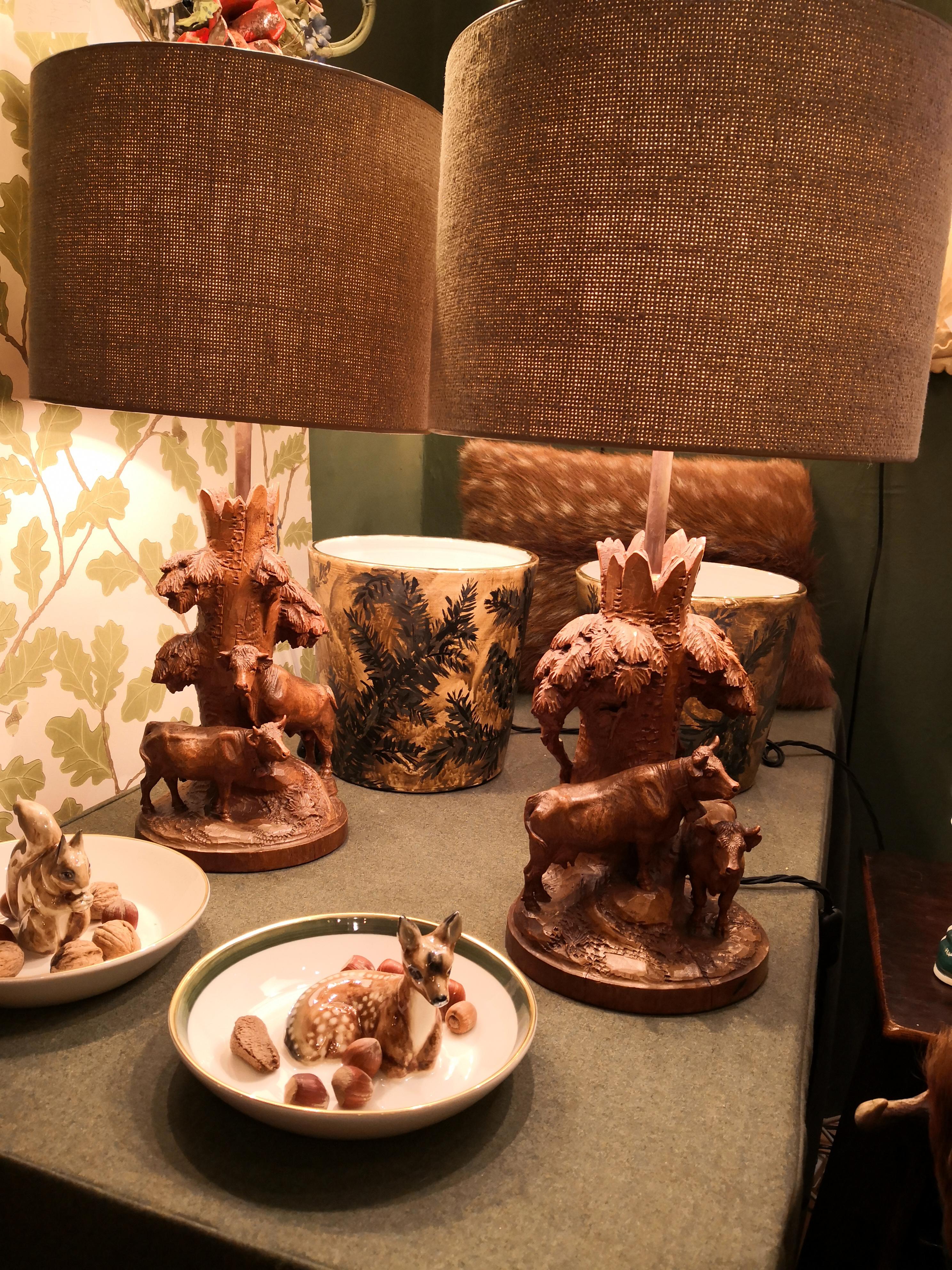 Pair of charming table lamps made of a hand-carved piece of basswood England end of 19th century. The lamp bases are hand carved with cows from one piece of wood in the autentic style of the 19th century. Very detailed hand-carved cows and leaves in