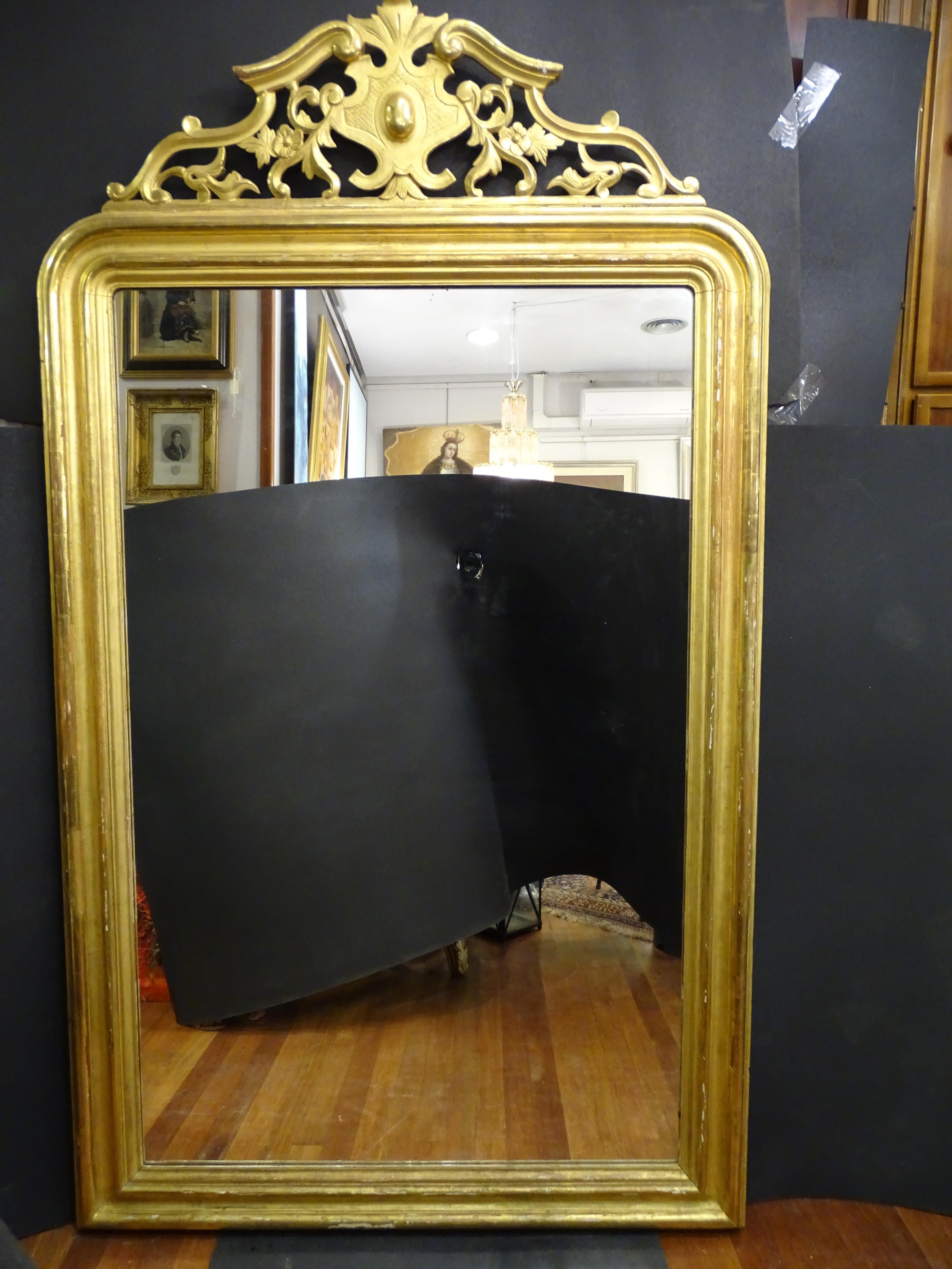 Outstanding wall mirror or Trumeau mirror in carved and gilded wood with 24 cts gold burnished with agate stone.
In a good condition with age and use.
Its an amazing mirror very sough after in the antique  antique market, it,s an amazing piece of