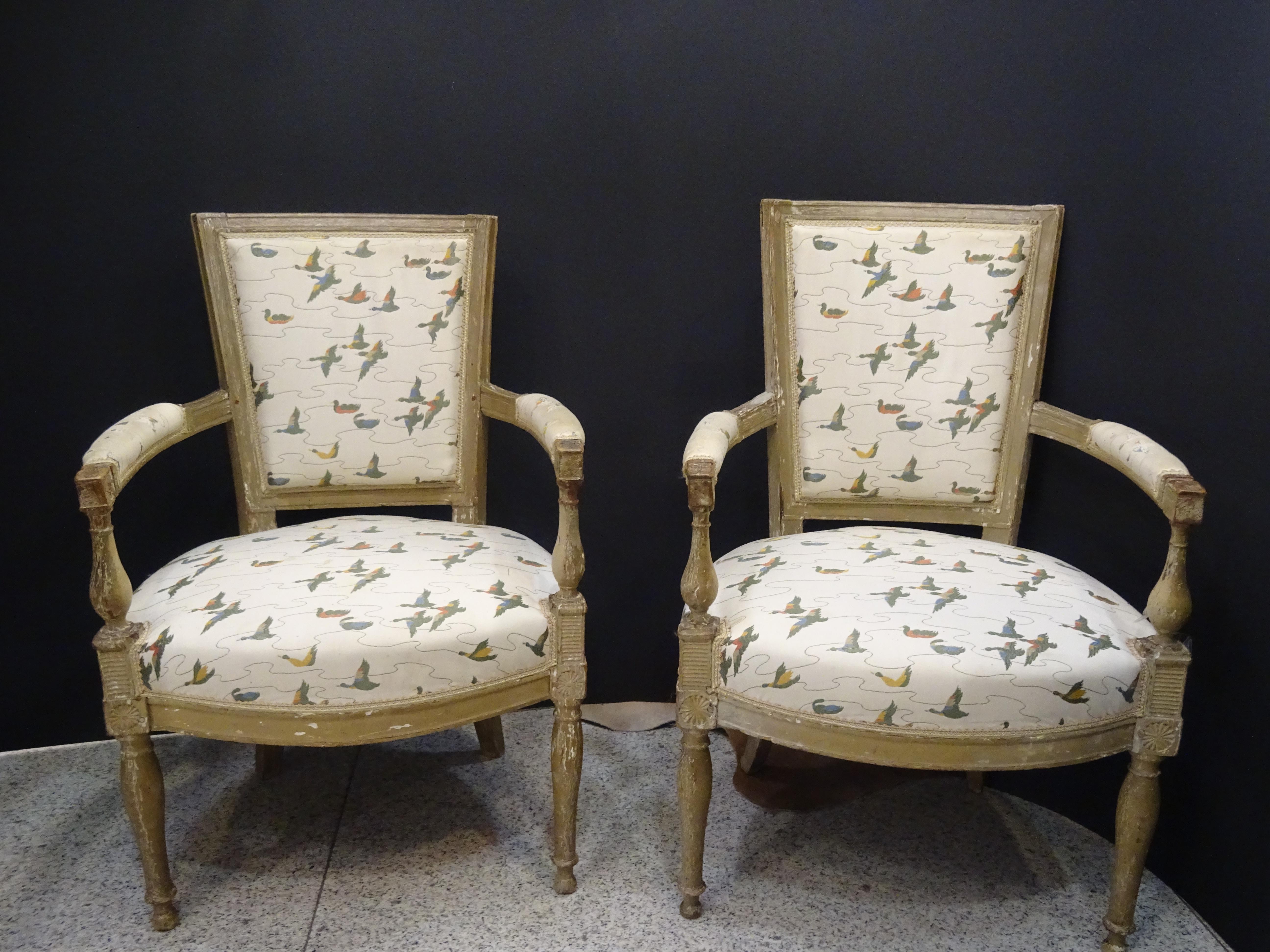 A beautiful and timeless couple of Luis XVI style French armchairs, with his original fabric, Napoleon III, circa 1860. In a off white wood with a exquisite patine!!! They are a very interesant couple of French armchairs which giving always a