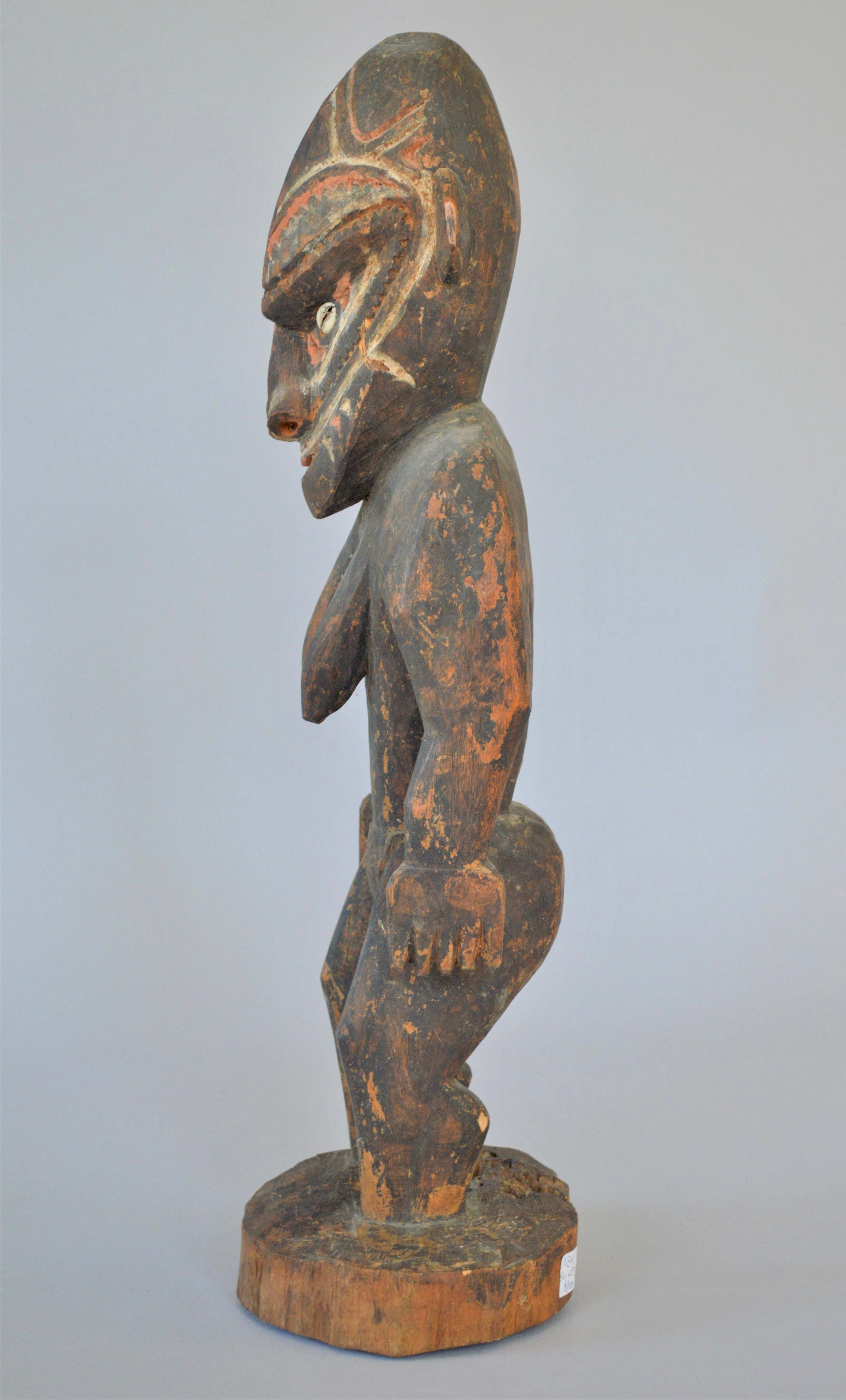 Malay worship female figure, carved in wood, standing with inlaid shell
Marked in buttom: 