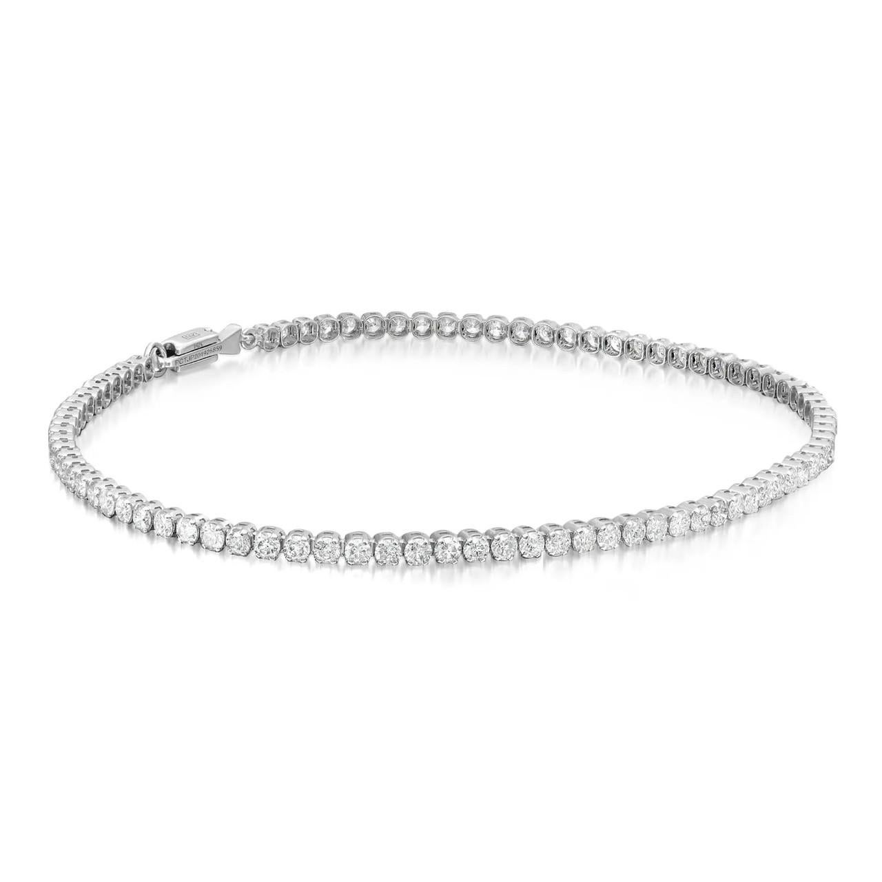 Elevate your wrist with the enchanting brilliance of this prong-set round brilliant cut diamond tennis bracelet, meticulously crafted in 14K white gold. It is beautiful and shimmering design adds a touch of sophistication to any occasion. This super