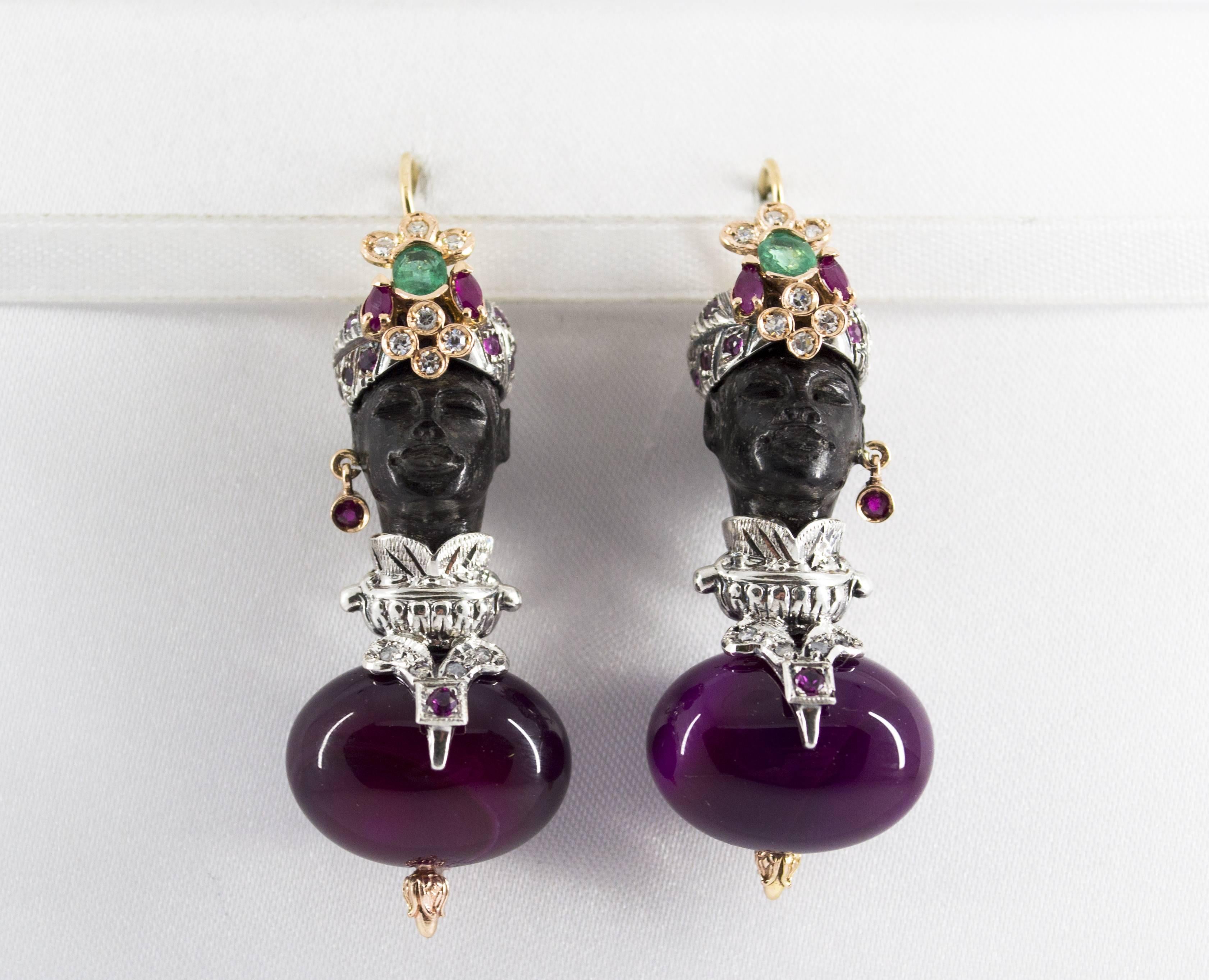 These Earrings are made of 9K Yellow Gold and Sterling Silver.
These Earrings have 0.35 Carats of Diamonds.
These Earrings have 1.90 Carats of Emeralds and Rubies.
These Earrings have also Ebony and Agate.
We're a workshop so every piece is