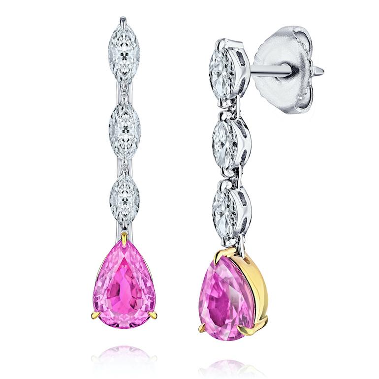 Two pear shape pink sapphires (natural no heat) weighing 1.90 carats set with six marquise diamonds weighing .55 carats (F+ VVS/VS+). Set in hand made platinum and 18k yellow gold push back earrings.
