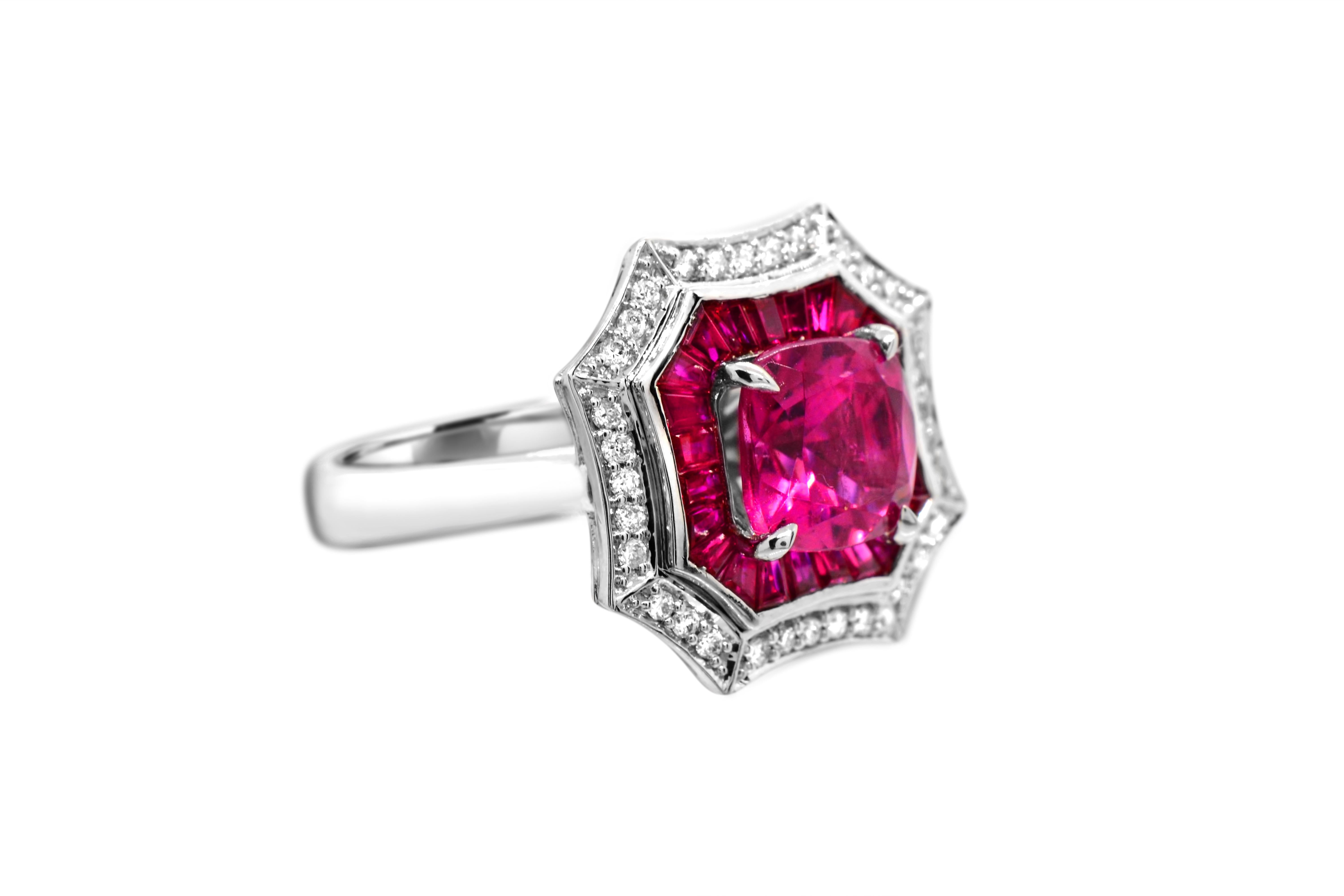 You will love this bright pink and fiery red combination! A gorgeous octagonal cocktail ring with diamond accents set in a 14kt white gold mounting. 
This is a real 