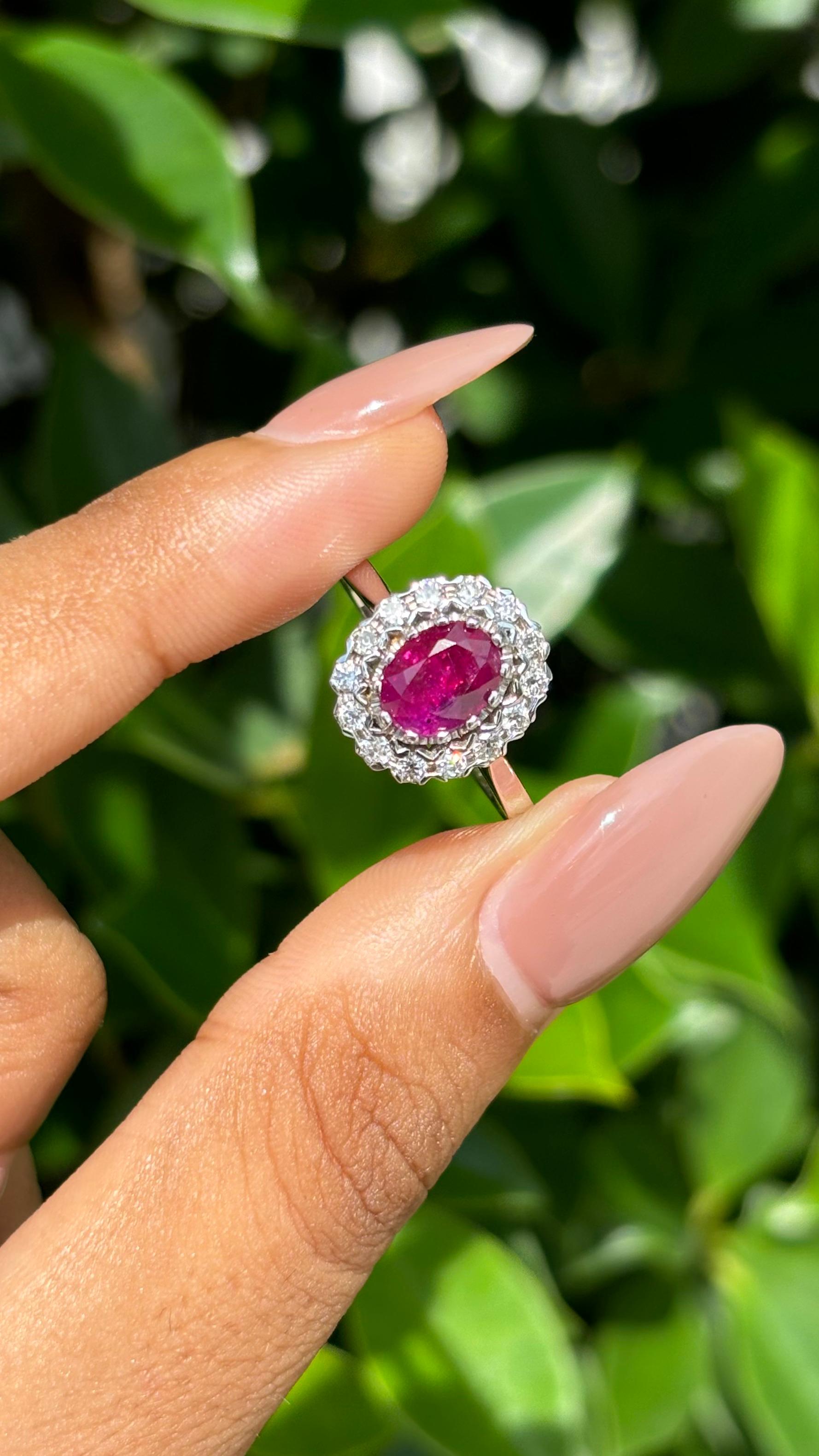 Indulge in the allure of exquisite jewelry with this captivating Ruby ring, a treasure that will leave all vintage jewelry enthusiasts and ruby lovers delighted. 

This magnificent ring showcases a breathtaking centerpiece—an oval-cut Ruby,