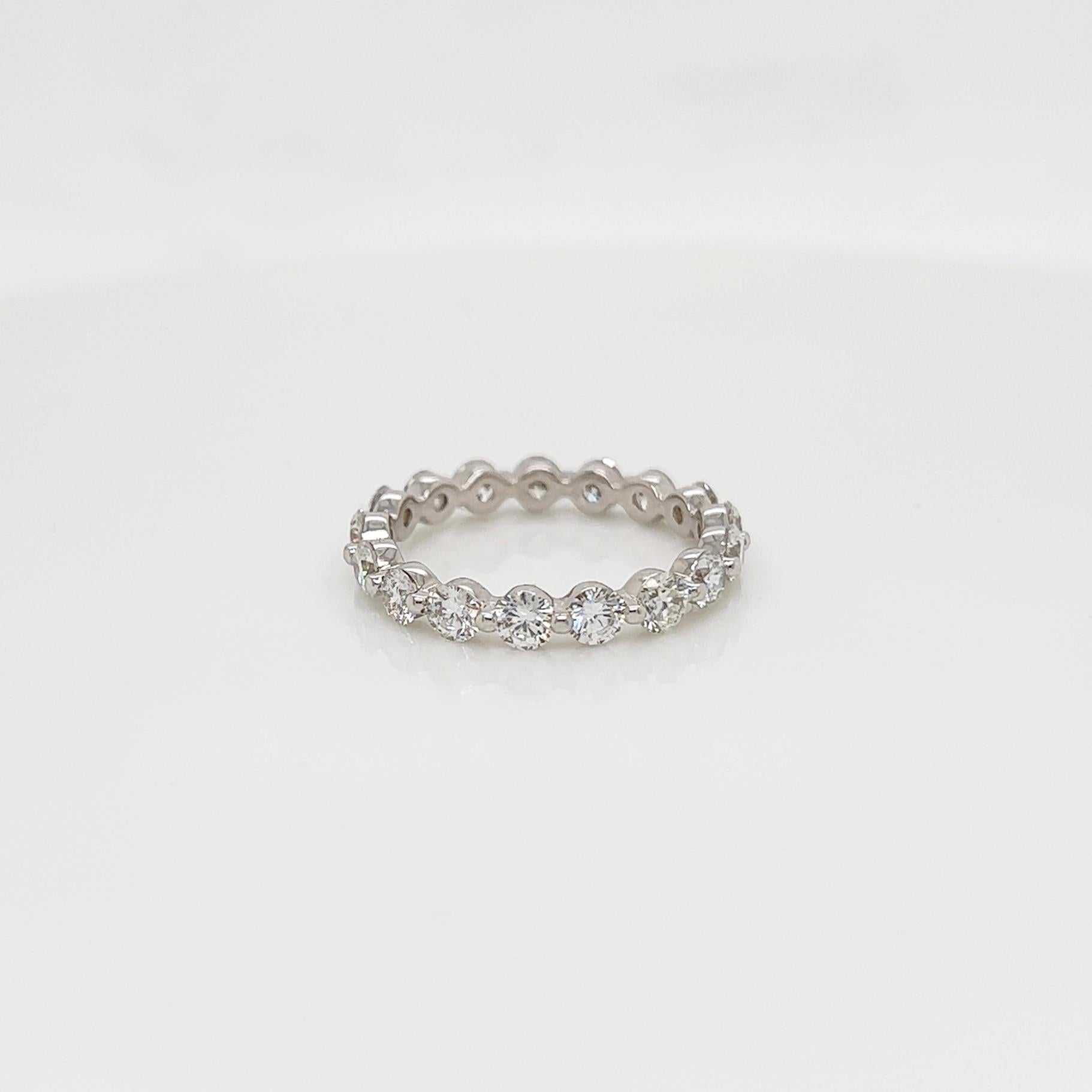 Ladies diamond Eternity band carries 1.90ct of brilliant cut diamonds placed in 14K white gold.

Size: 6.0
Color: G-H
Clarity: SI1+

This shared prong style Eternity band was handmade by our jewelers in New York City.