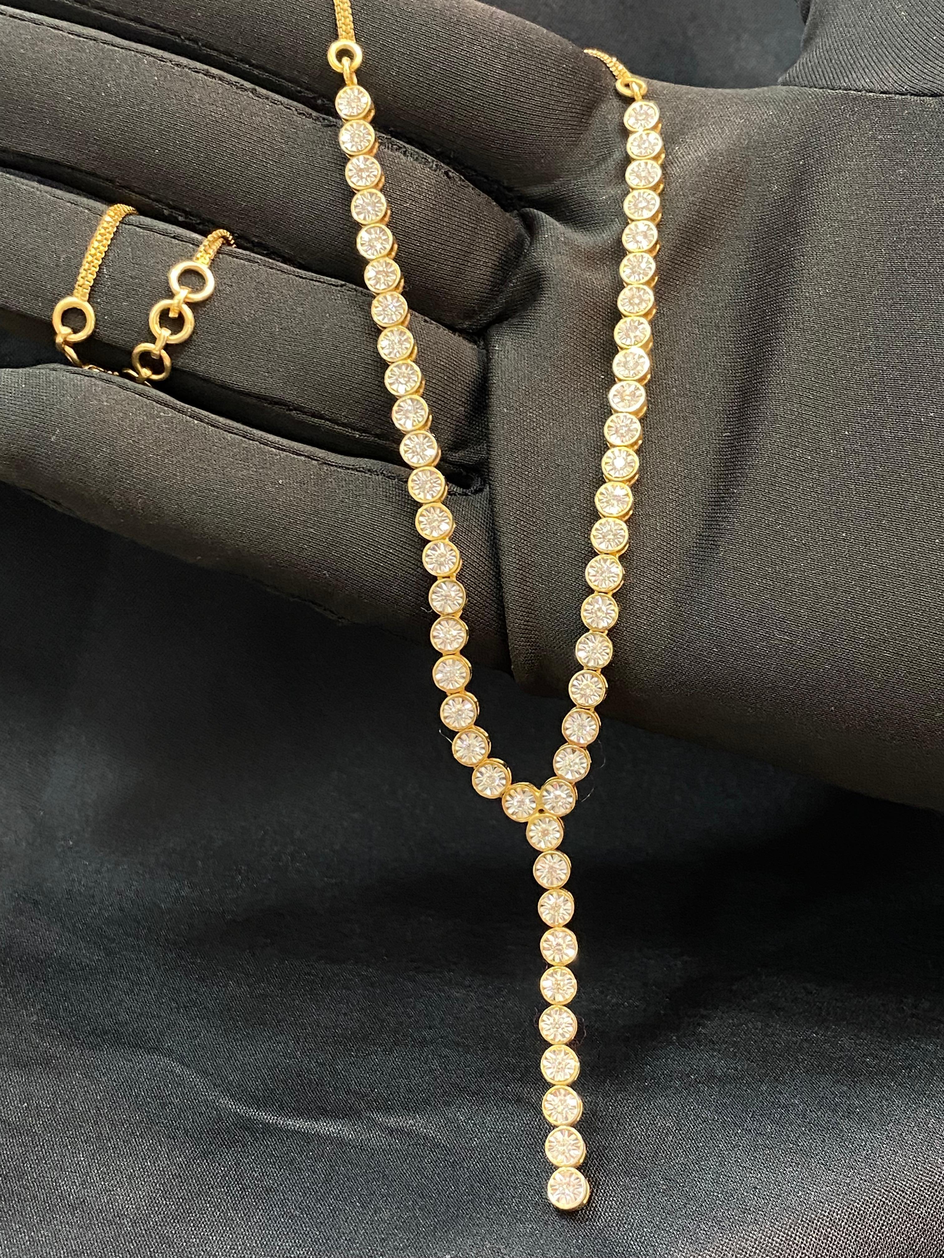 This exquisite necklace showcases a meticulously crafted ensemble of 1.90 carats of Round Brilliant Cut natural diamonds delicately set in an authentic 14K yellow gold tennis necklace. With unparalleled attention to detail, this piece embodies