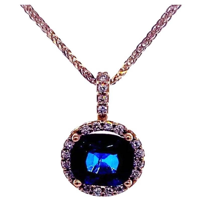 Halo drop pendant 1.90 CT Sapphire Pink Gold Diamond Necklace
The pendant is 3/4 in length and 9.20 mm in diameter. 
The deep blue and sparkling sapphire is cushion cut and measures 6.63 x 6.30 x 4.50 mm with a weight of 1.75 carats.

Diamonds are