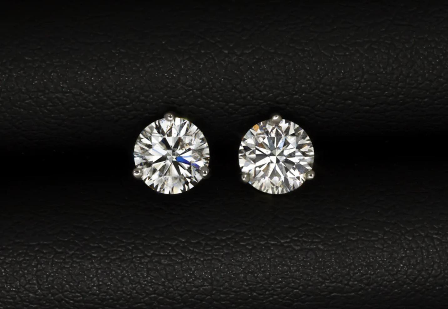 This pair of 1.90 carat round brilliant cut diamond ear studs are very well cut, eye clean when worn and a strikingly brilliant white color.
 
They are 100% natural diamonds and have not received any treatment or enhancement of any kind.
They are
