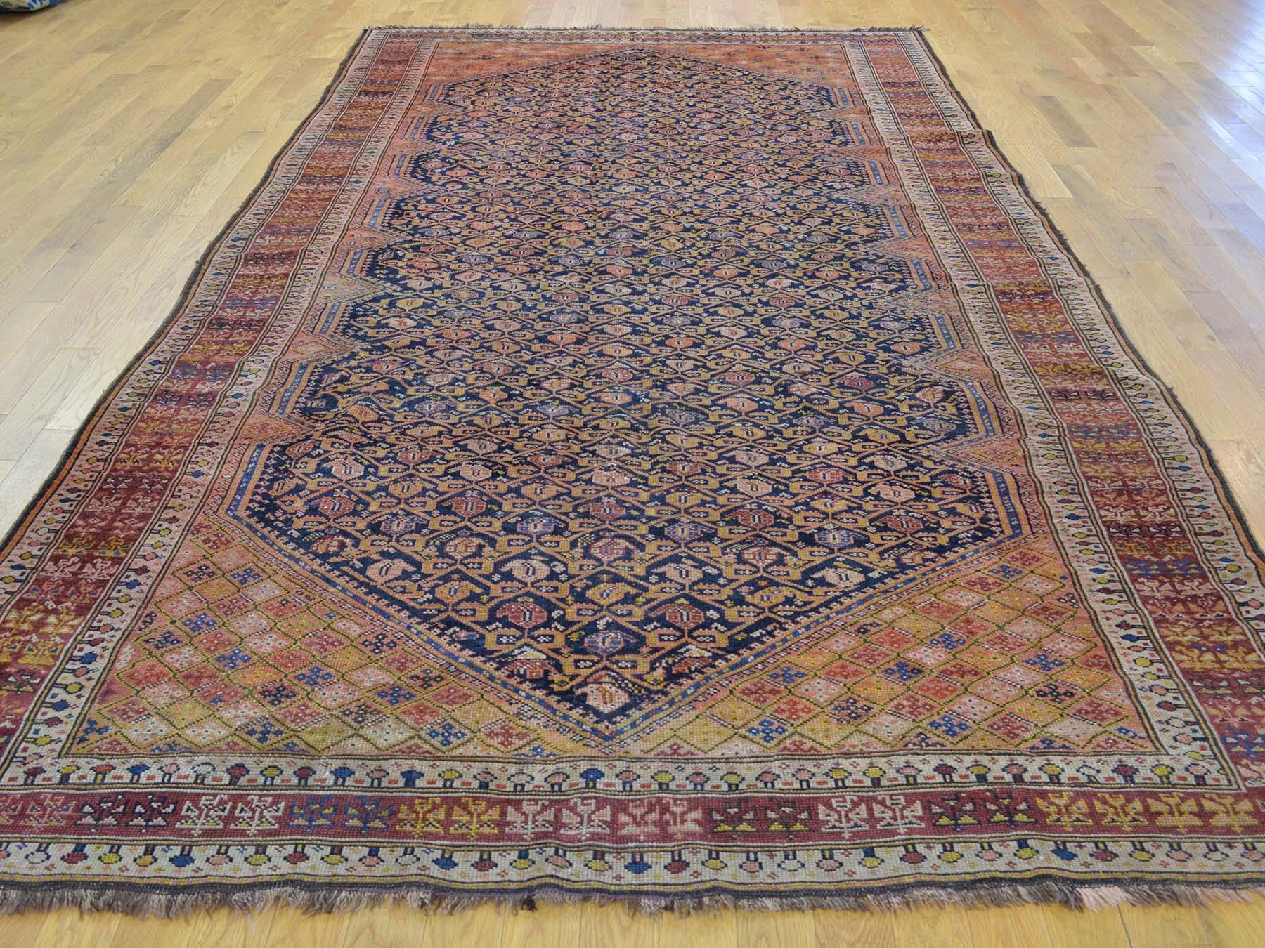 This is a genuine hand knotted oriental rug. It is not hand tufted or machine made rug. Our entire inventory is made of either hand knotted or handwoven rugs.

Start a new room with this superb gallery size carpet. This handcrafted antique