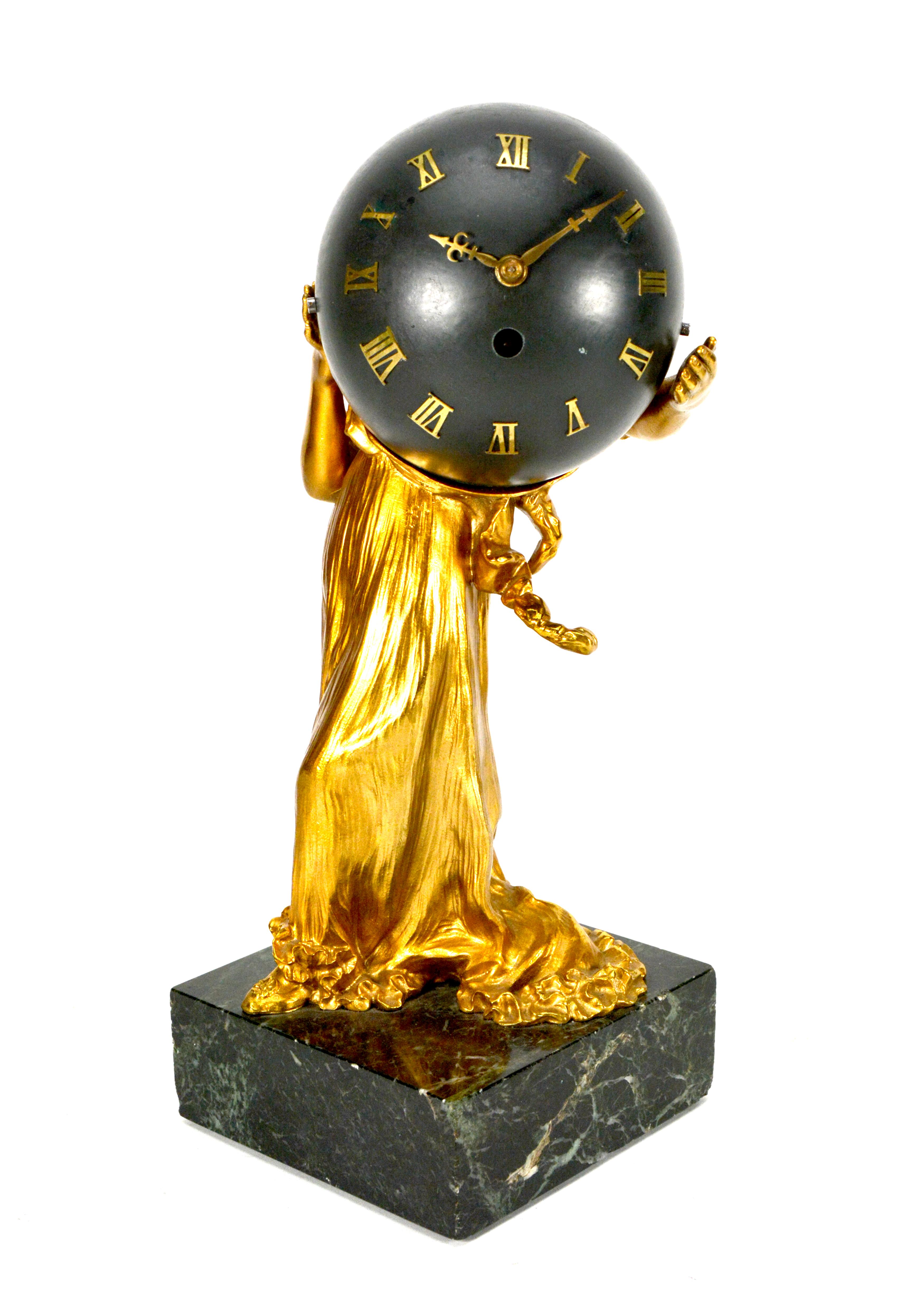 1900 Antique French Ormolu Gilt Bronze Elegant Lady Marble Base Ball Clock

Here we are offering a beautiful French bronze elegant lady figure ball clock. The elegant lady is made of bronze and in excellent ormolu condition. She stands on a heavy