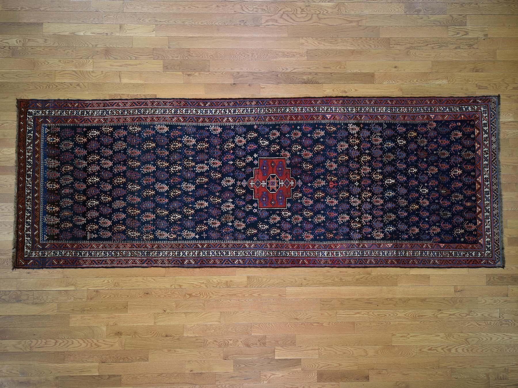 This is a genuine hand knotted oriental rug. It is not hand tufted or machine made rug. our entire inventory is made of either hand knotted or handwoven rugs.

Bring life to your home with this lovely hand knotted carpet. This handcrafted antique is