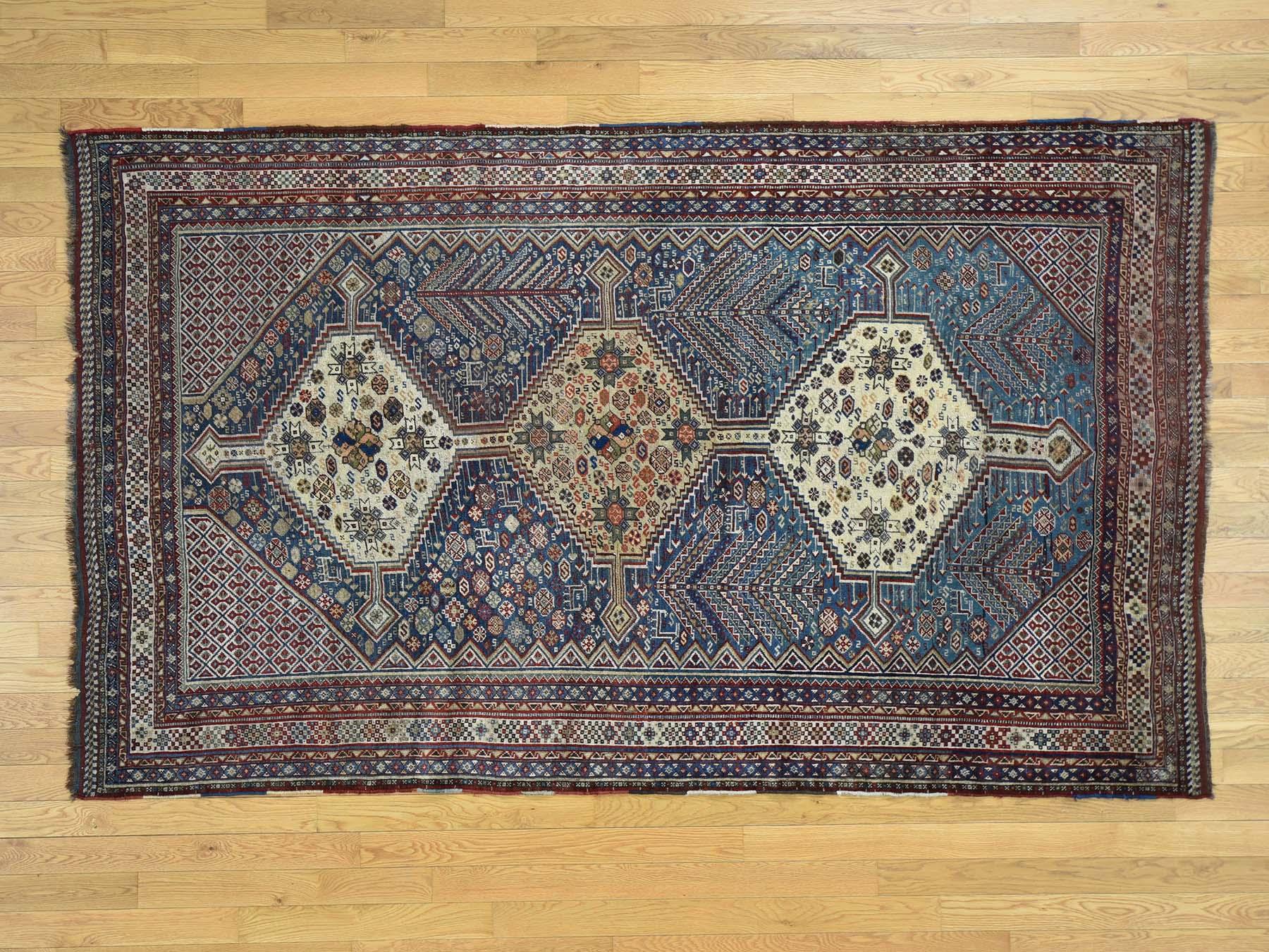 This is a genuine hand knotted oriental rug. It is not hand tufted or machine made rug. Our entire inventory is made of either hand knotted or handwoven rugs.

Remodel your home with this stunning antique carpet. This handcrafted Persian Qashqai