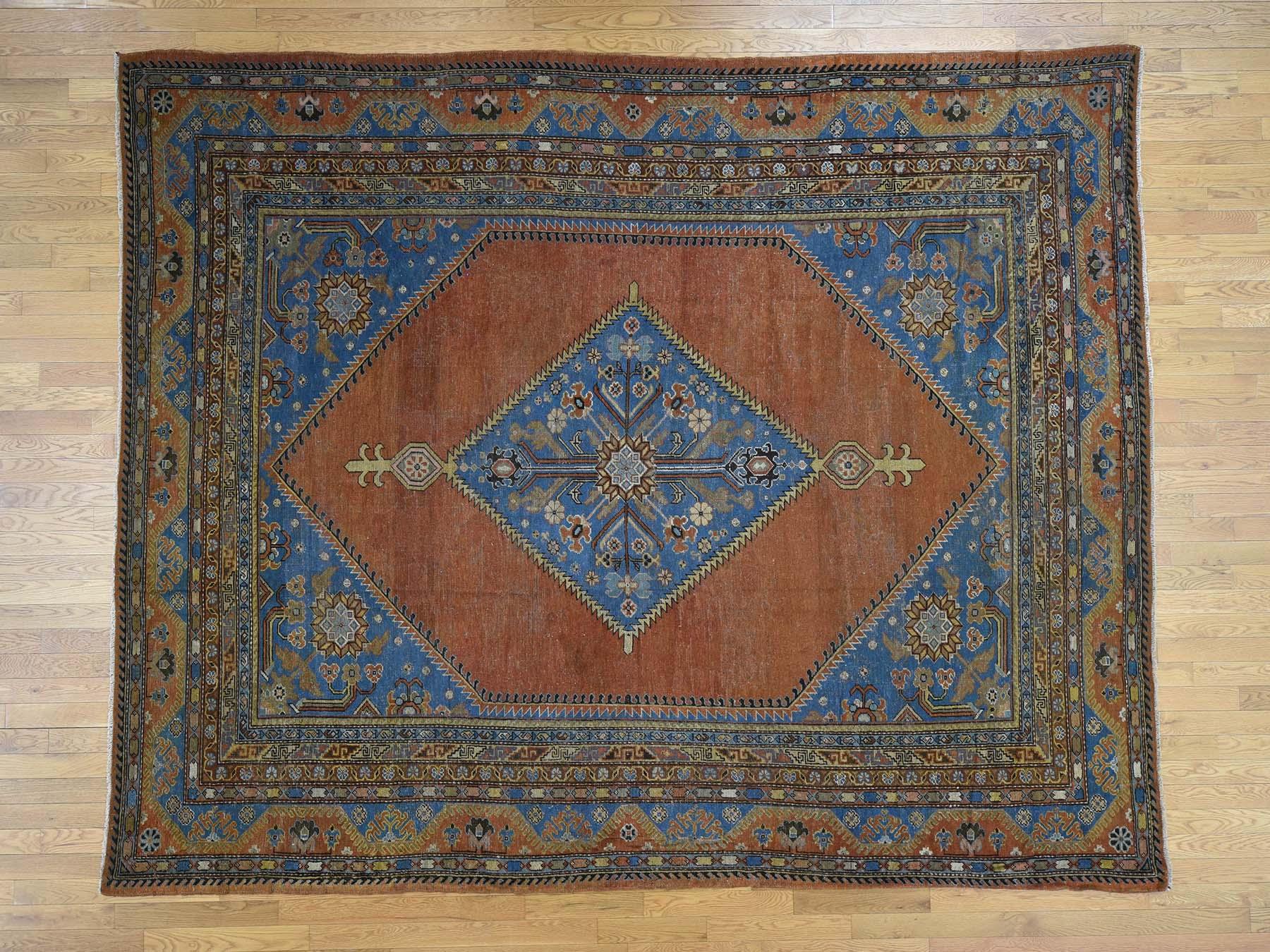 This is a genuine hand knotted oriental rug. It is not hand tufted or machine made rug. Our entire inventory is made of either hand knotted or handwoven rugs.

Enhance your home with this magnificent antique carpet. This handcrafted Samarkand
