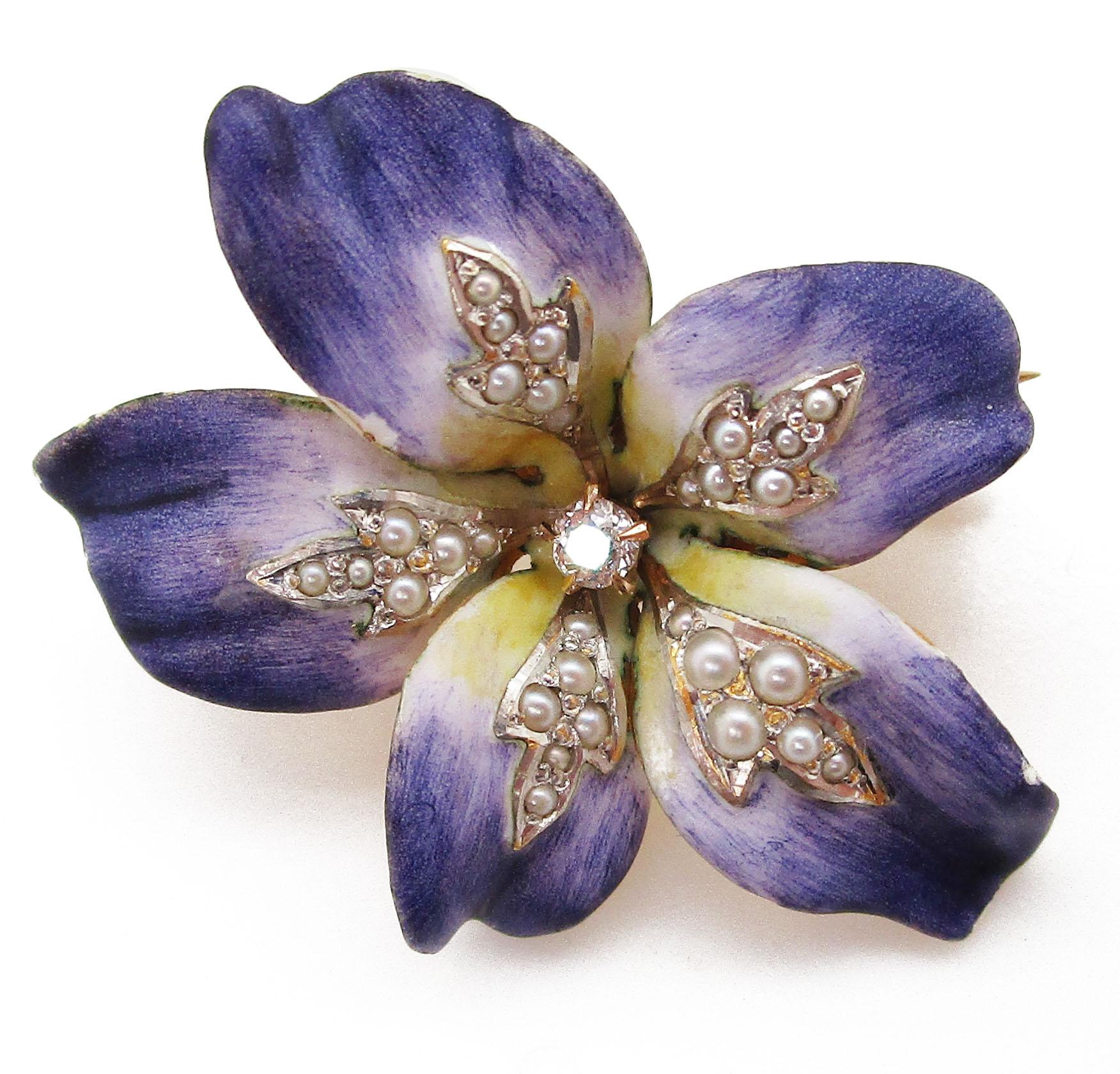 This gorgeous pin pendant is an Art Nouveau style piece that dates back to 1900. It is shaped like a violet and the hand-painted enamel makes the petals look incredibly realistic! The delicate violet tones of the petals look so real that when you