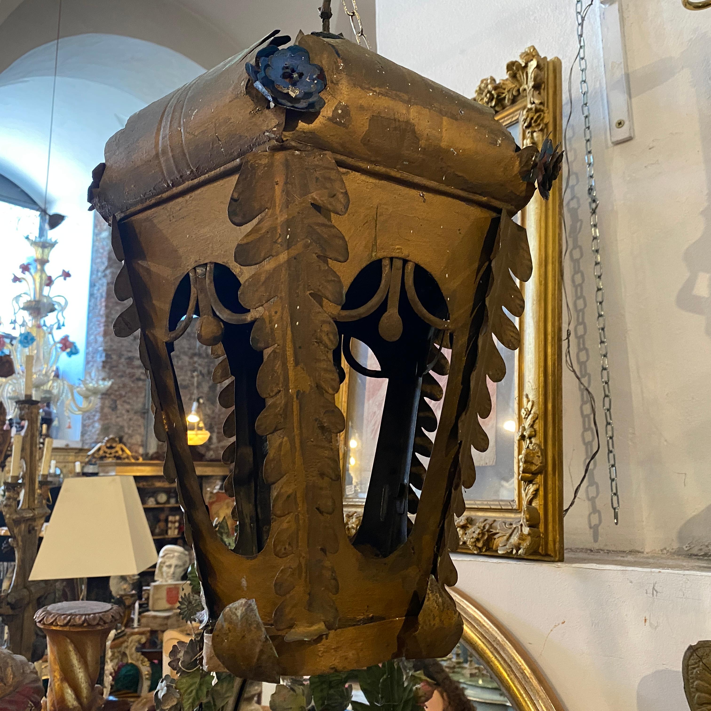 It's an Italian procession lantern, now if electrified, it can be used as a charming pendant. The gilded and blue iron it's in original conditions and it has normal signs of use and age.