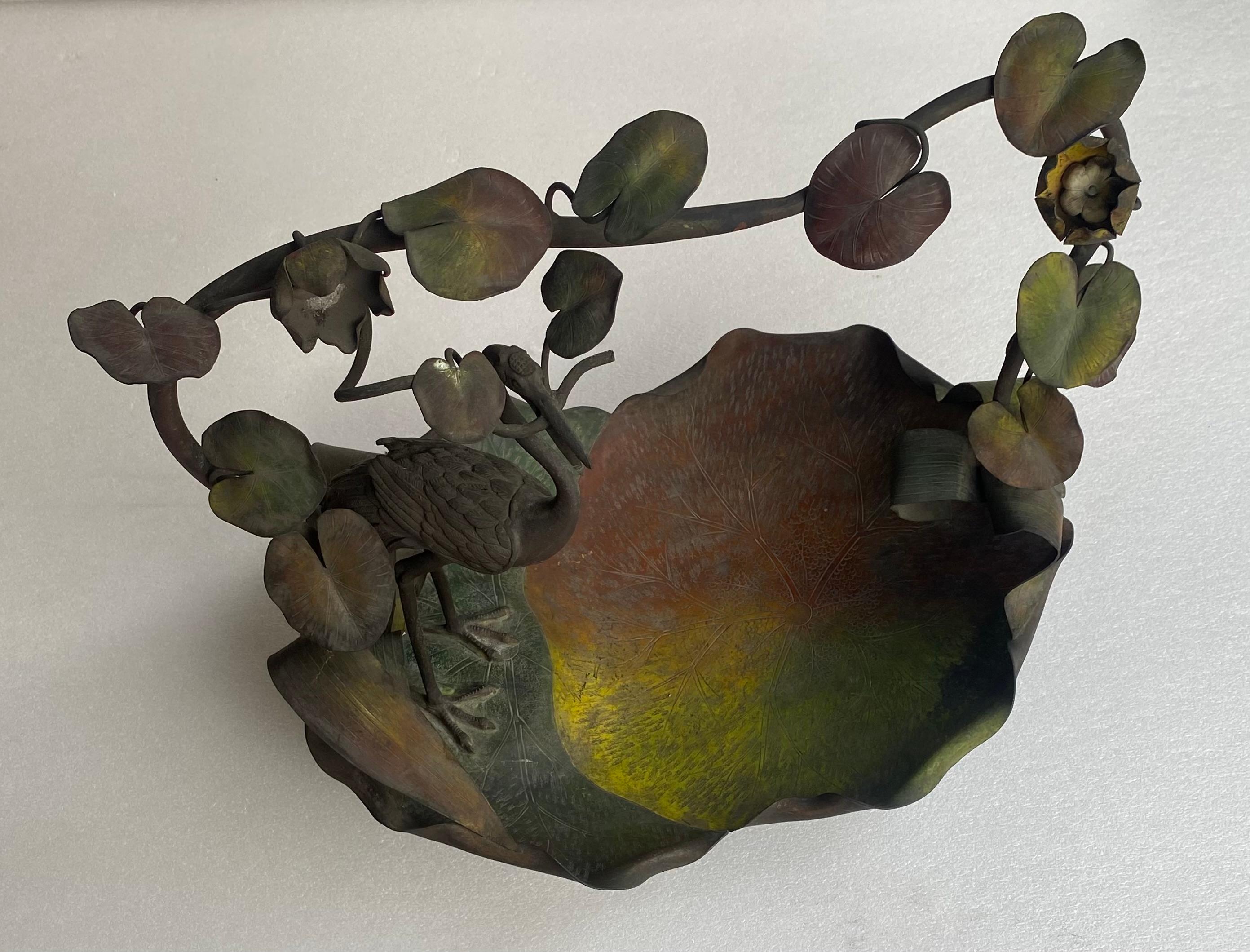 Fruit basket in polychrome patinated bronze.
Wading bird in the middle of a decoration of water lilies
Length: 58 cm
Width:47 cm
Height:54 cm
condition of use
Work 1900