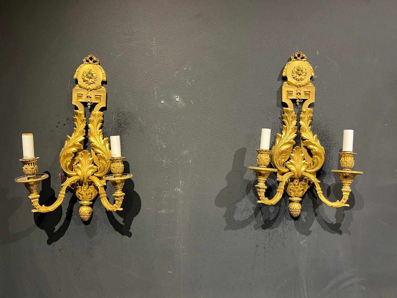 A pair of circa 1900 Caldwell gilt bronze sconces with Acanthus leaves design.
