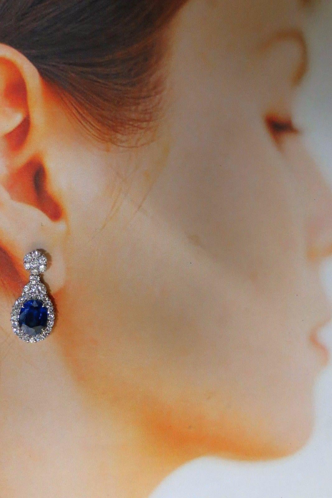Cluster Drop Dangle Earrings.

16.00ct. Created Lab Sapphires

 Oval shaped, Full Cut.

Transparent & Fine Royal Blue tone.

11 X 9mm each sapphire.



3.00cts of natural round & marquise diamonds: 

G-color, Vs-2 clarity.

14kt. white gold

9