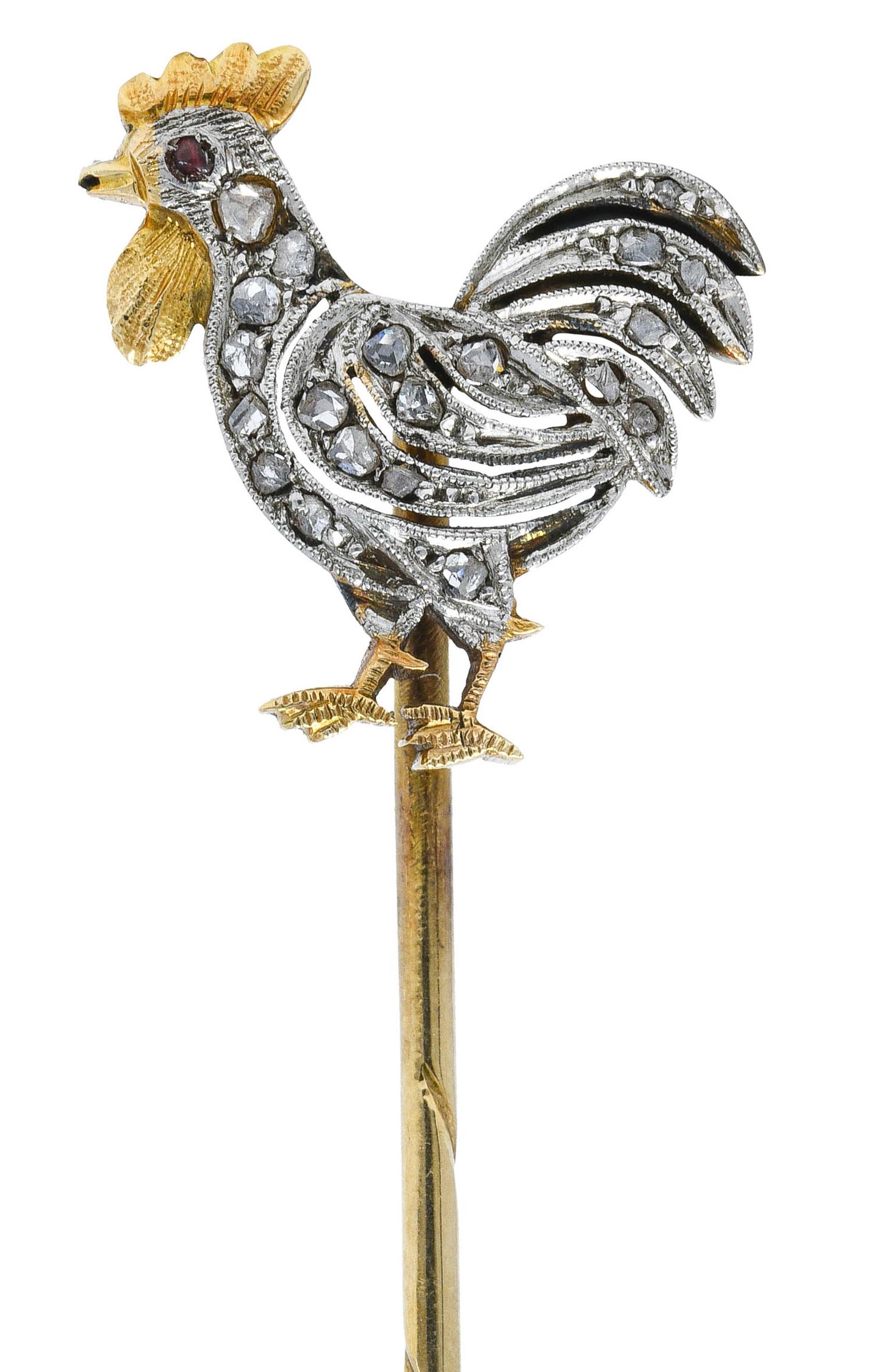 Designed as a strutting rooster with flouncing tail feathers

Comb, waddle, and feet are bright gold with engraved details

Feathered body is set throughout with rose cut diamonds while eye is a purplish red garnet

With maker's mark and tested as