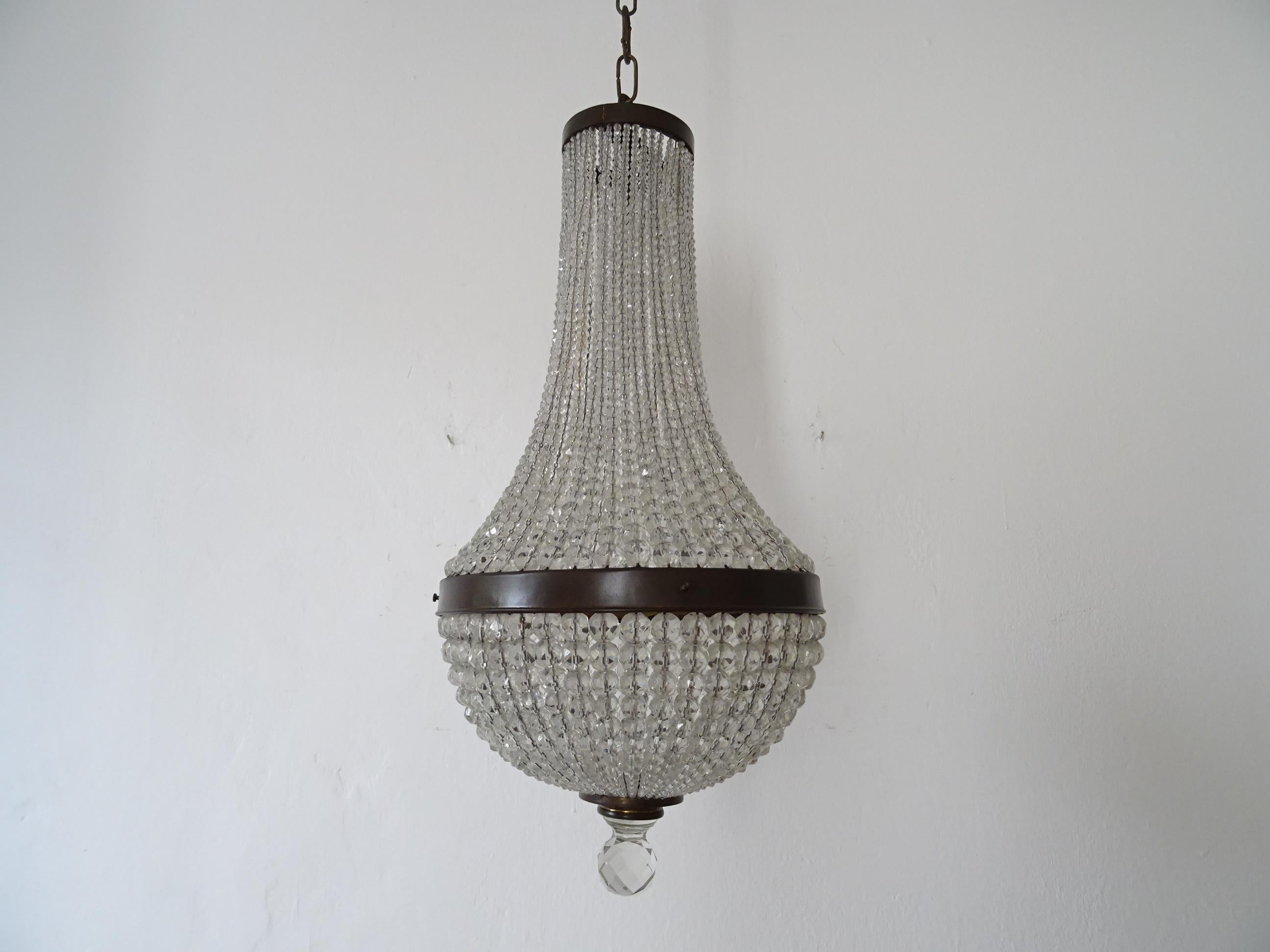 Housing one light, rewired and ready to hang. We use certified UL US sockets and appropriate sockets for all other countries. Strands and strands of crystal beads with crystal finial on bottom. Adding another 15 inches of original chain and canopy.