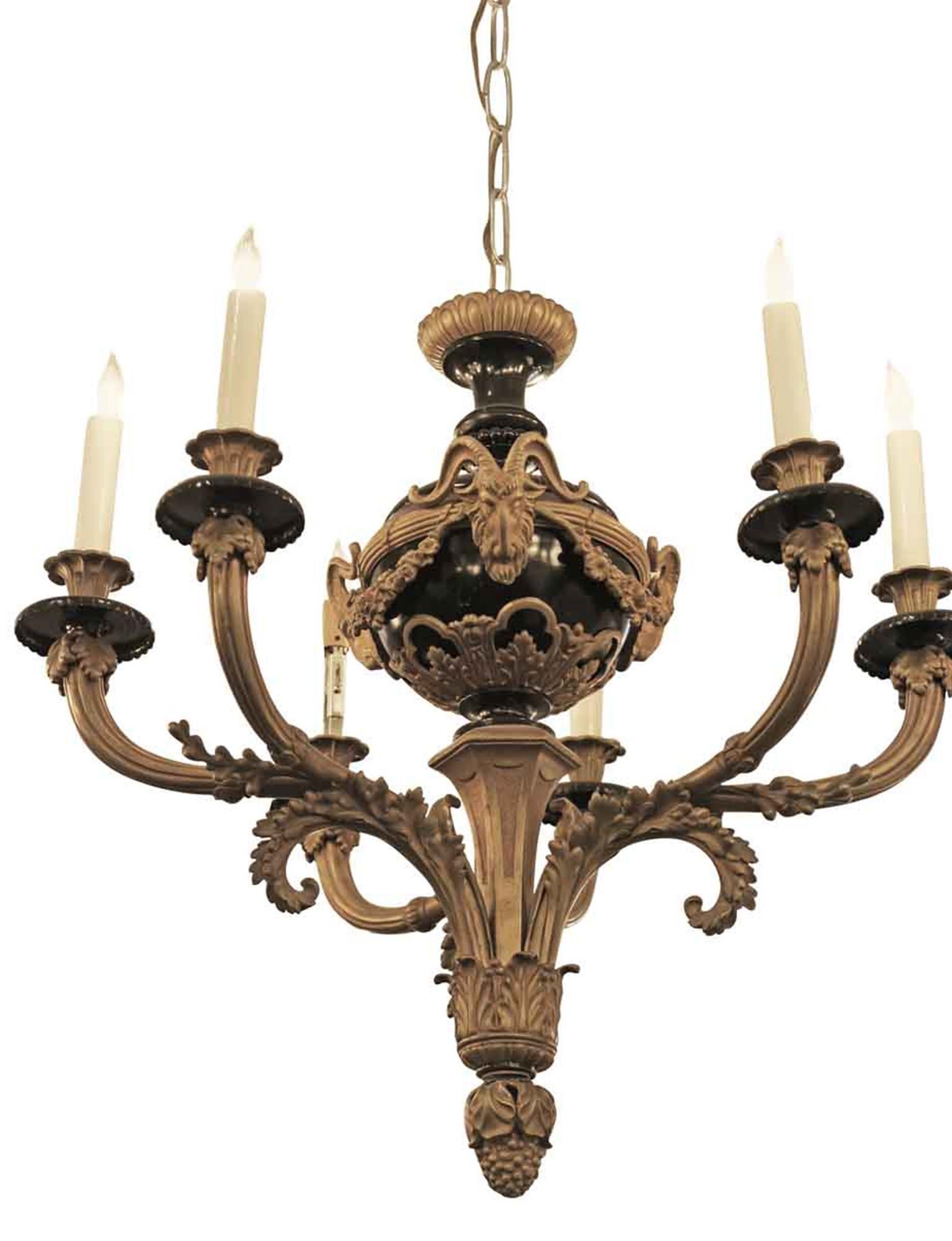 Empire style black and gold ormolu bronze six-arm chandelier with nicely articulated goat head and floral details. Made in France, circa 1900. This can be seen at our 302 Bowery location in Manhattan.
