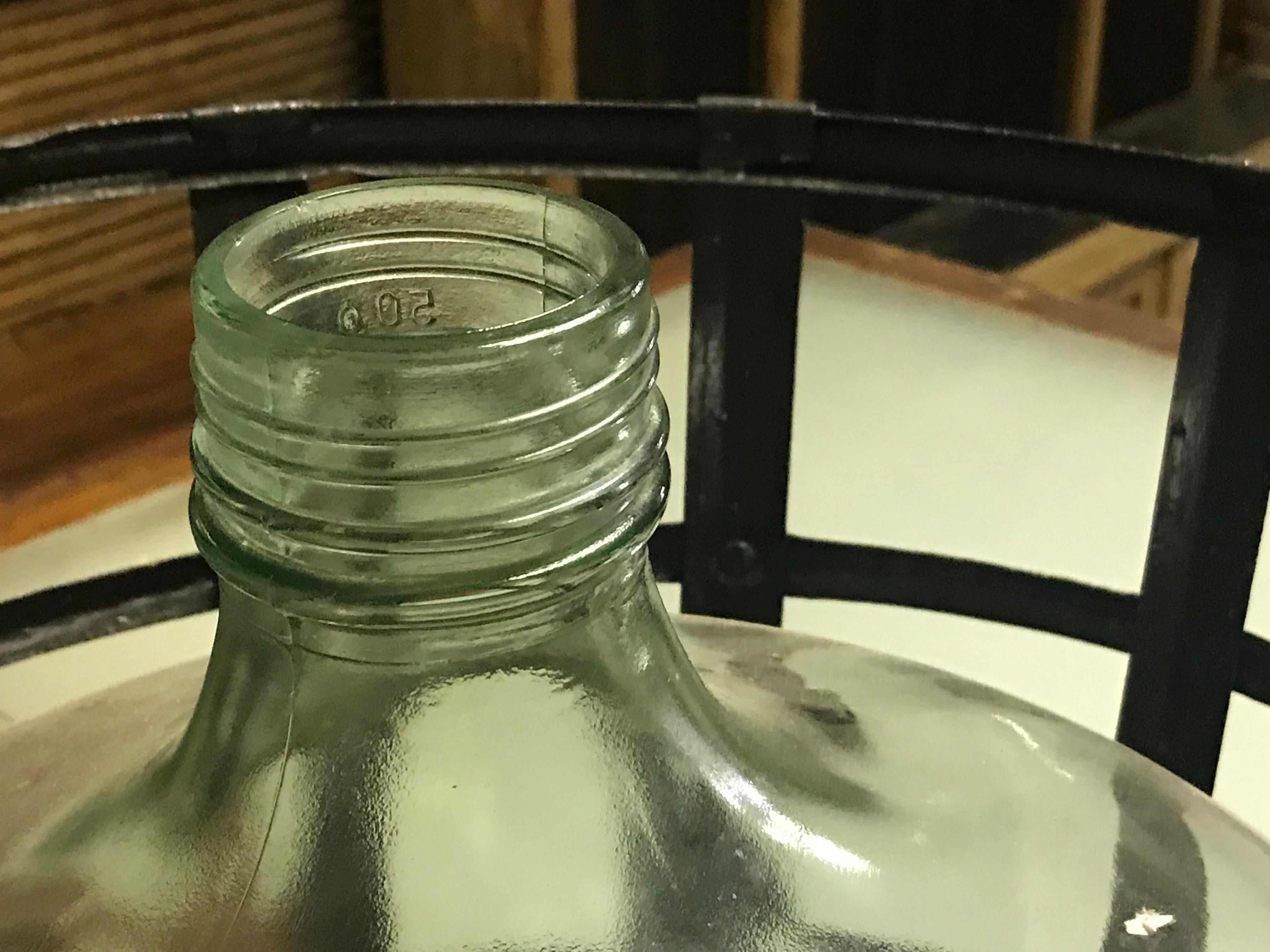 1900 French Metal Baskets with Bottles in Clear and Green Glass In Good Condition In Los Angeles, CA