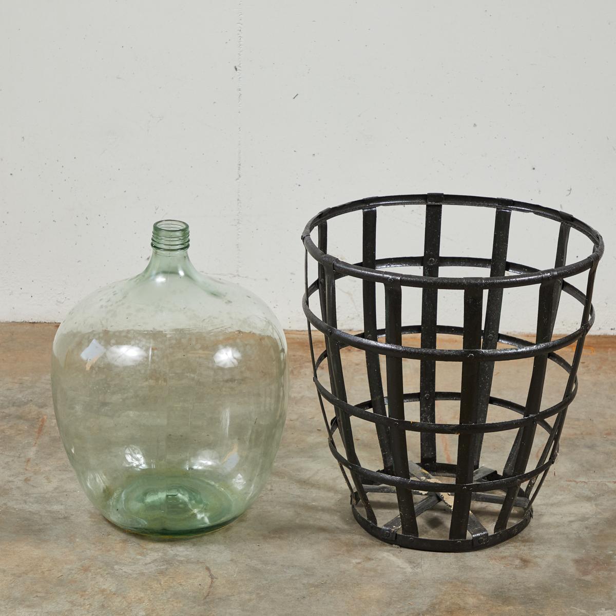 Early 20th Century French Metal Baskets with Bottles in Clear and Green Glass In Good Condition For Sale In Los Angeles, CA