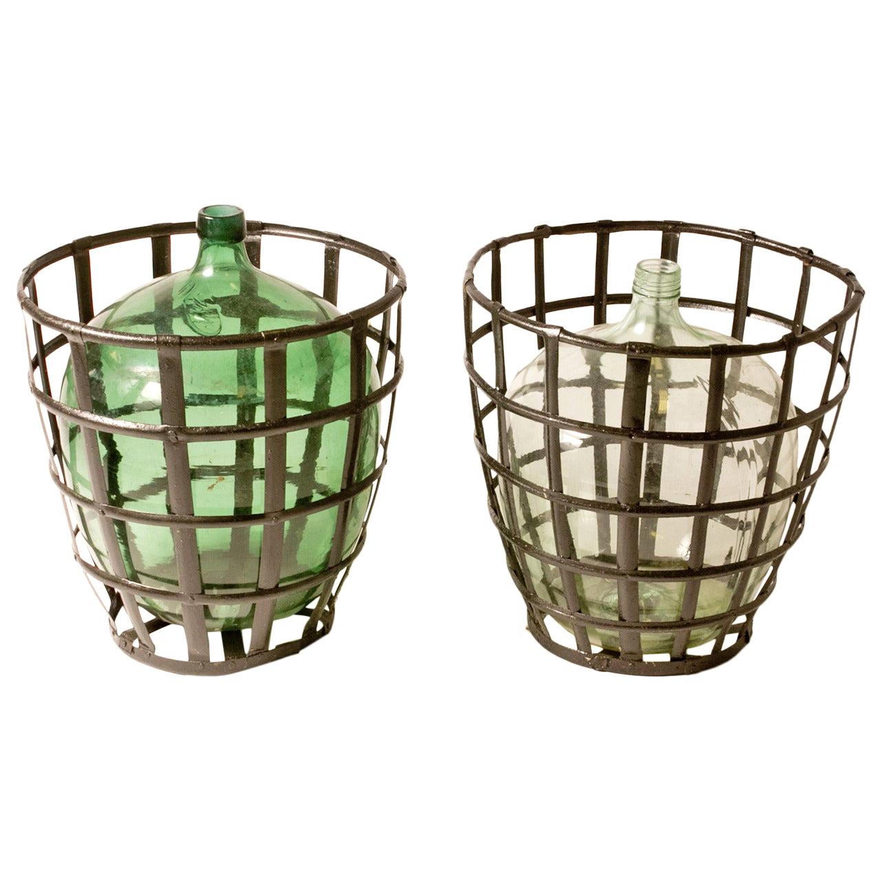 Early 20th Century French Metal Baskets with Bottles in Clear and Green Glass