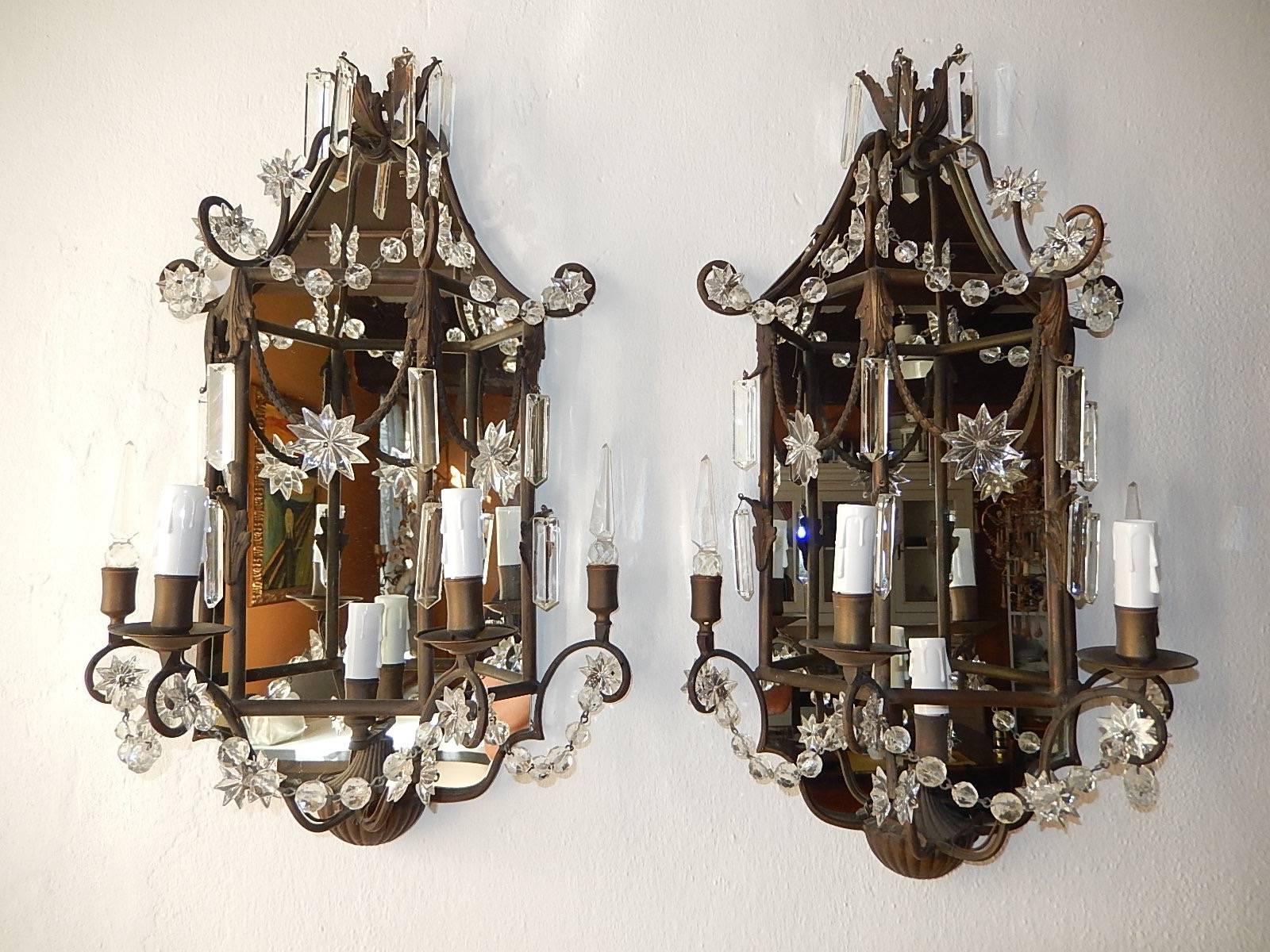 Housing three-lights. Will be re-wired with certified UL US sockets for the United States and appropriate sockets for other countries and ready to hang. Adorning crystal stars, prisms, balls and spears, all intact. Mirrors were replaced. Free