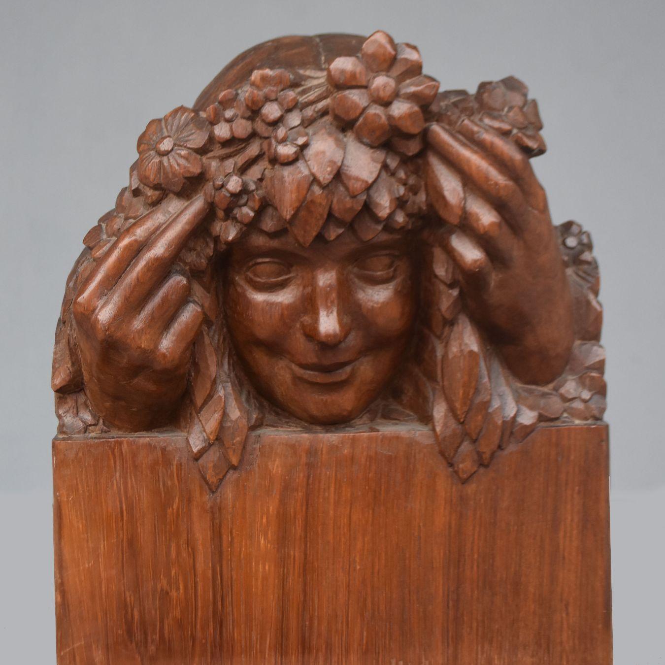 Head of a young girl with flowers Art Nouveau style 1900 period patinated wood.