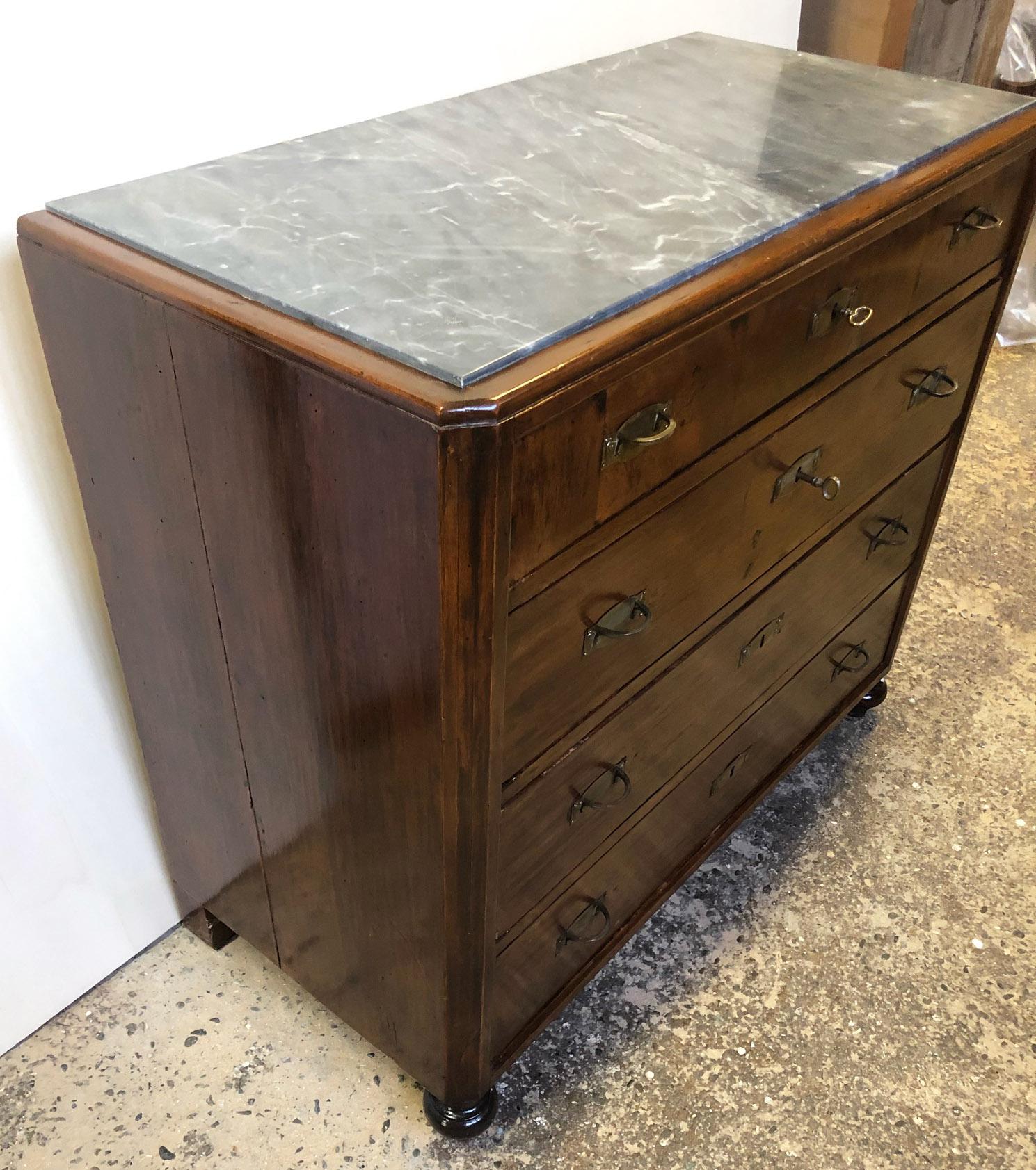 1900 Original Italian chest of drawers in walnut, veneered on fir, with four drawers and gray marble. 
Comes from an old country house in the centre of Chianti area of Tuscany.
The paint is original in patina, honey amber color. 
As shown in the