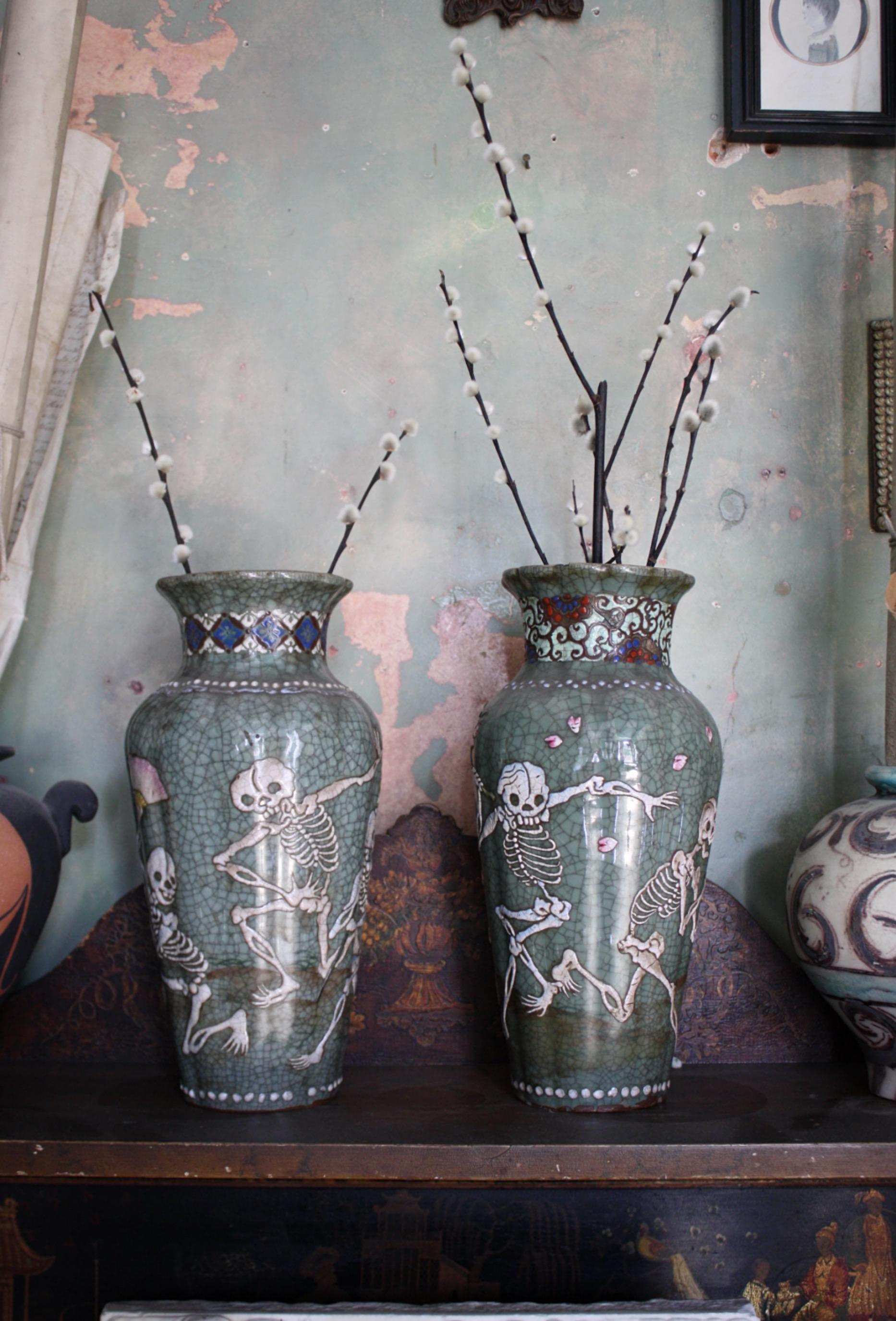 A fine pair of Seto ware vases, adored with dancing Skeltons applied with a ivory white slip on a heavily cratqelured green ground. 



Each vase has a differing decorative collar, along with some elderly repairs around each rim, circa 1900 in age