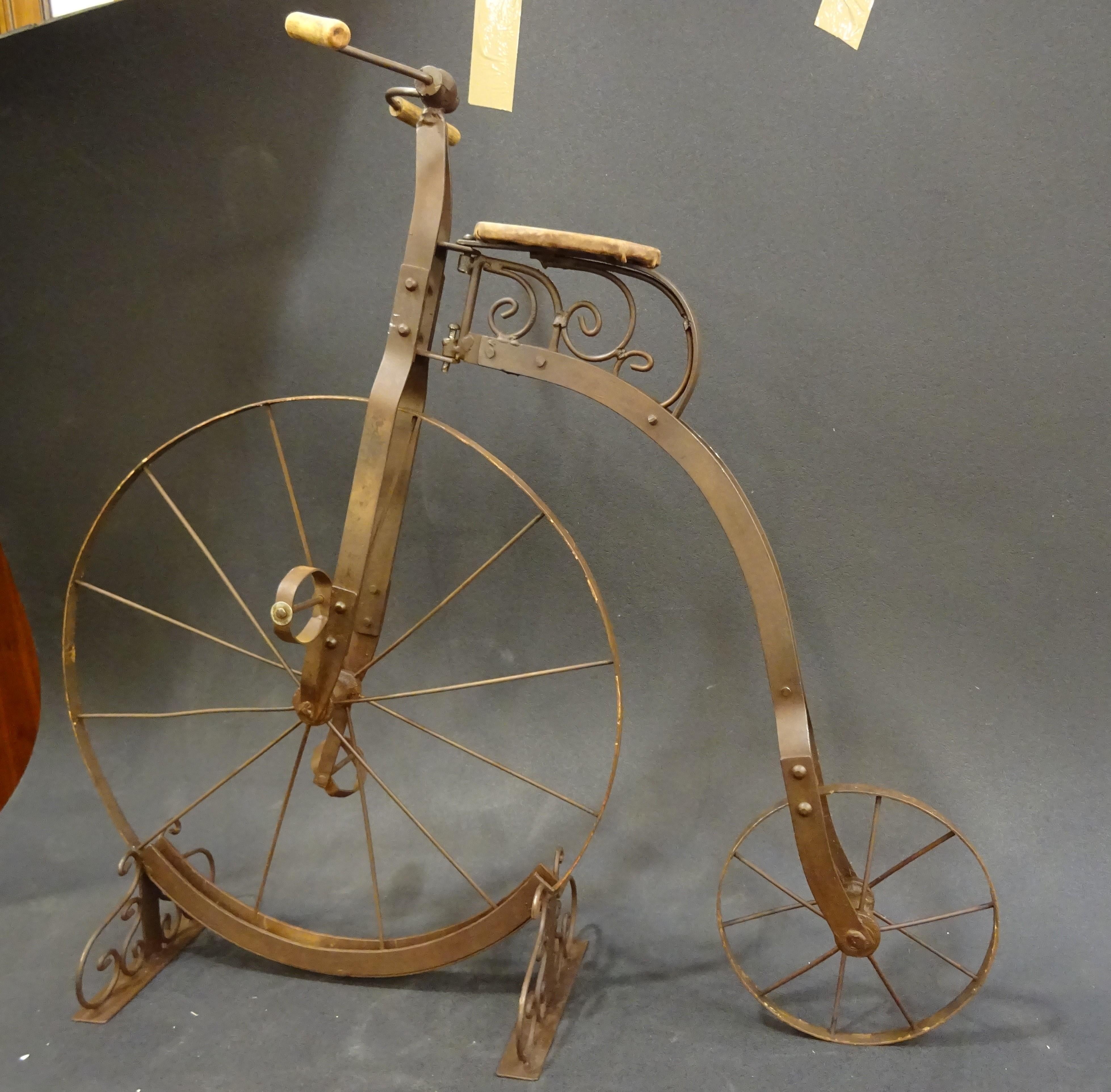 An antique Penny- Farthing bicycle for children from the early 20th century. It is made of twisted iron bars forged and fully bonded togheter by struck rivets. The wheels are made of metal as well without a rubber strip.
They are not warped and no