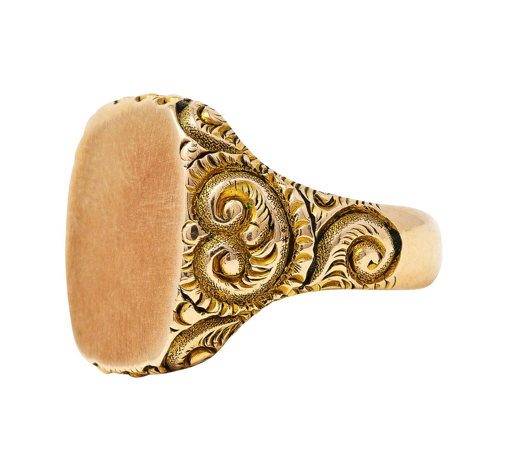 Signet style ring designed with cushion shaped face

Featuring deeply grooved scroll motif shoulders

Tested as 14 karat gold

Ring size: 6 and sizable

Measures: 15.5 mm North to South and sits 2.0 mm high

Total weight: 5.4 grams

Elegant.