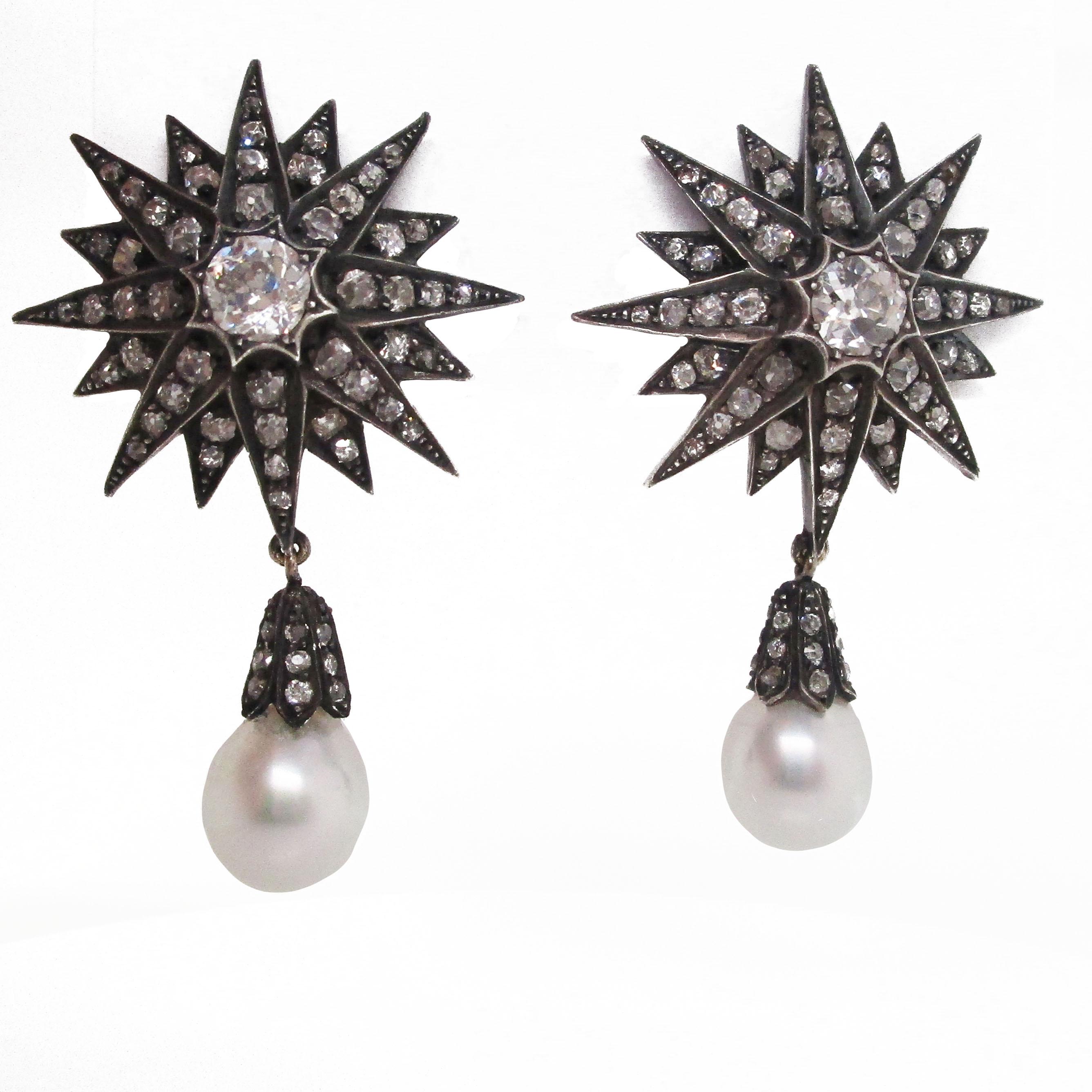 These absolutely knockout earrings are from the Victorian Era and feature a staggering 14 carats of old mine-cut diamonds in silver over gold starburst-shaped earrings. The top of the earrings features a sprawling star design with layered ‘arms’ of