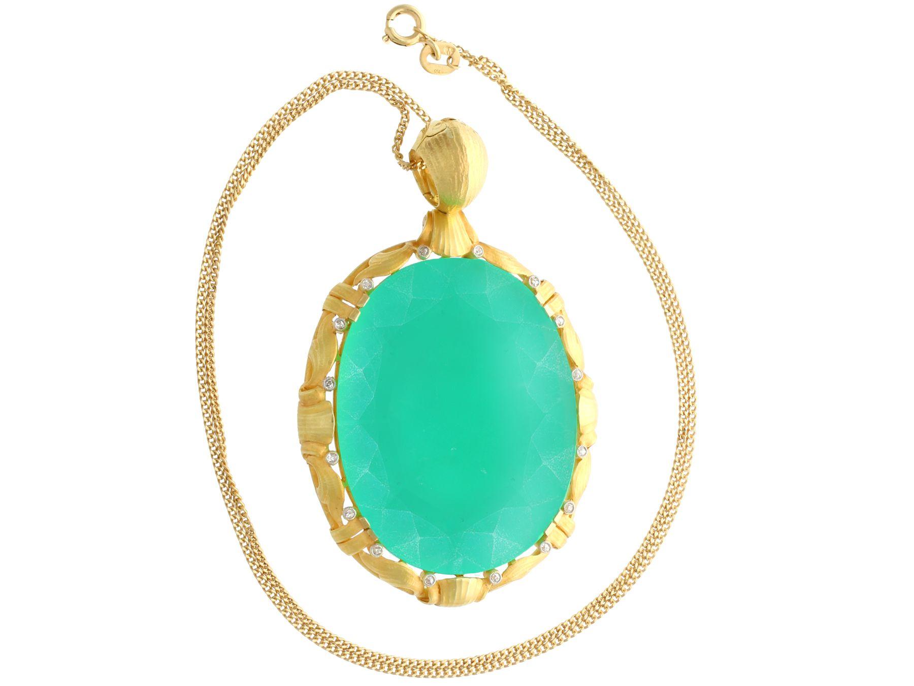 A stunning, fine and impressive antique 51.69 carat chrysoprase (green chalcedony), 0.16 carat diamond, 15k yellow gold pendant; part of our antique jewelry and estate jewelry collections.

This stunning antique cabochon cut chrysoprase pendant has