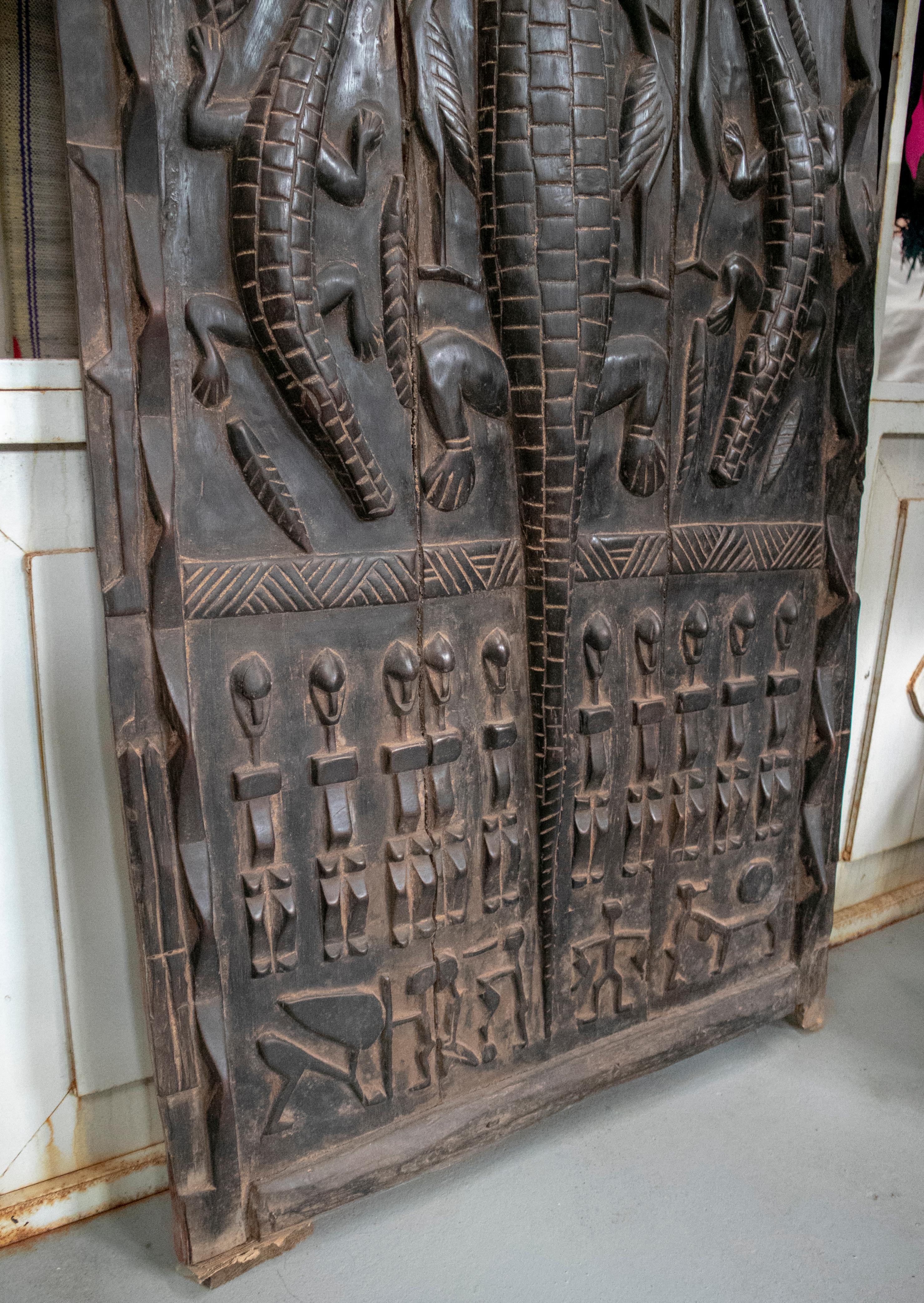 1900s African Wooden Door with Hand Carved Ethnic Human and Animal Relief In Good Condition In Marbella, ES