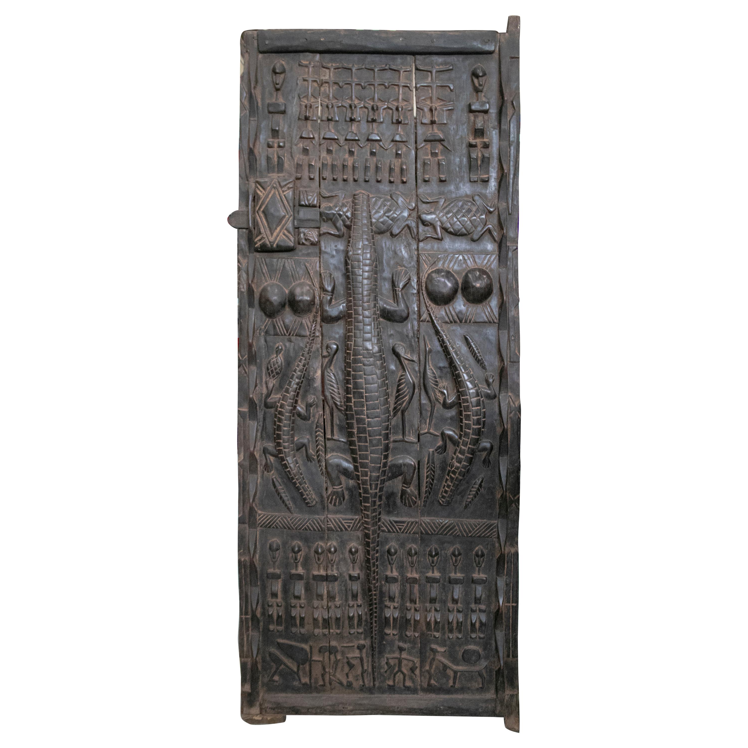 1900s African Wooden Door with Hand Carved Ethnic Human and Animal Relief