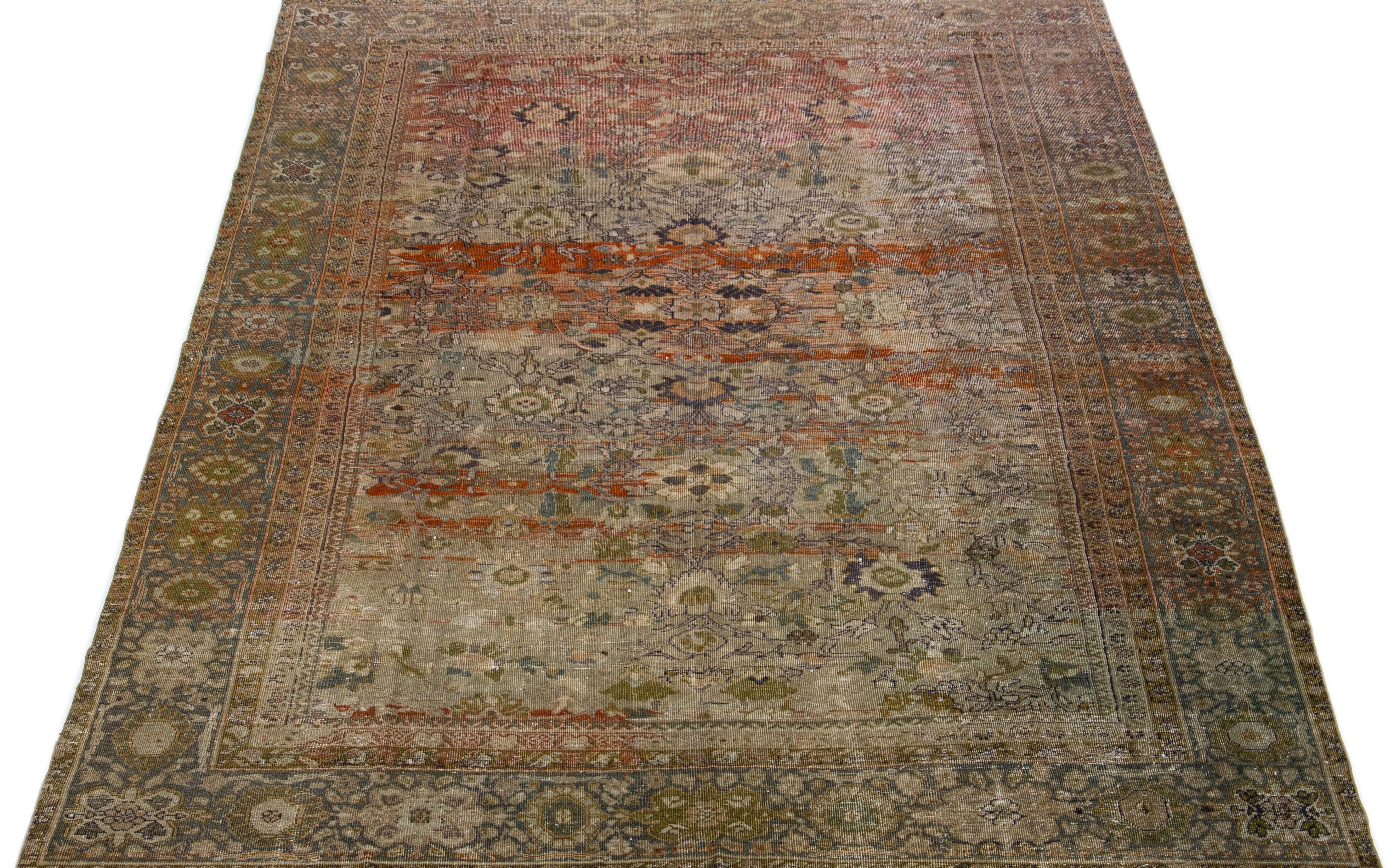 Beautiful hand knotted 1900s antique Sultanabad wool rug with a brown color field. This Persian rug has rust, green, and gray accent colors in an all-over floral design. This Classic rug design is made to last with a strong wool weave from