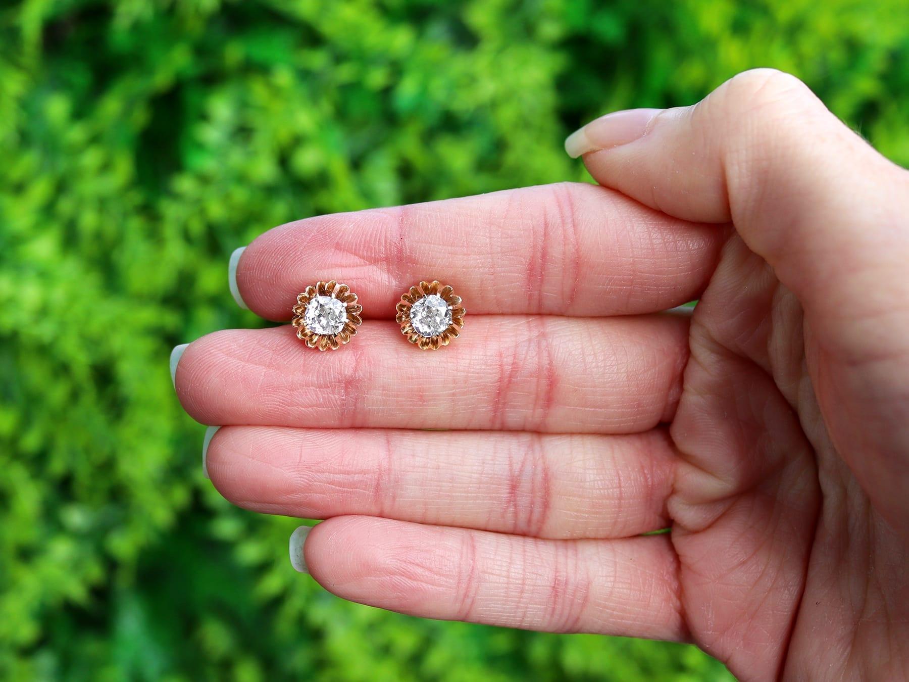 An impressive pair of antique 1.13 carat diamond and 14 karat yellow gold stud earrings; part of our diverse antique jewelry and estate jewelry collections.

These fine and impressive antique diamond earrings have been crafted in 14k yellow