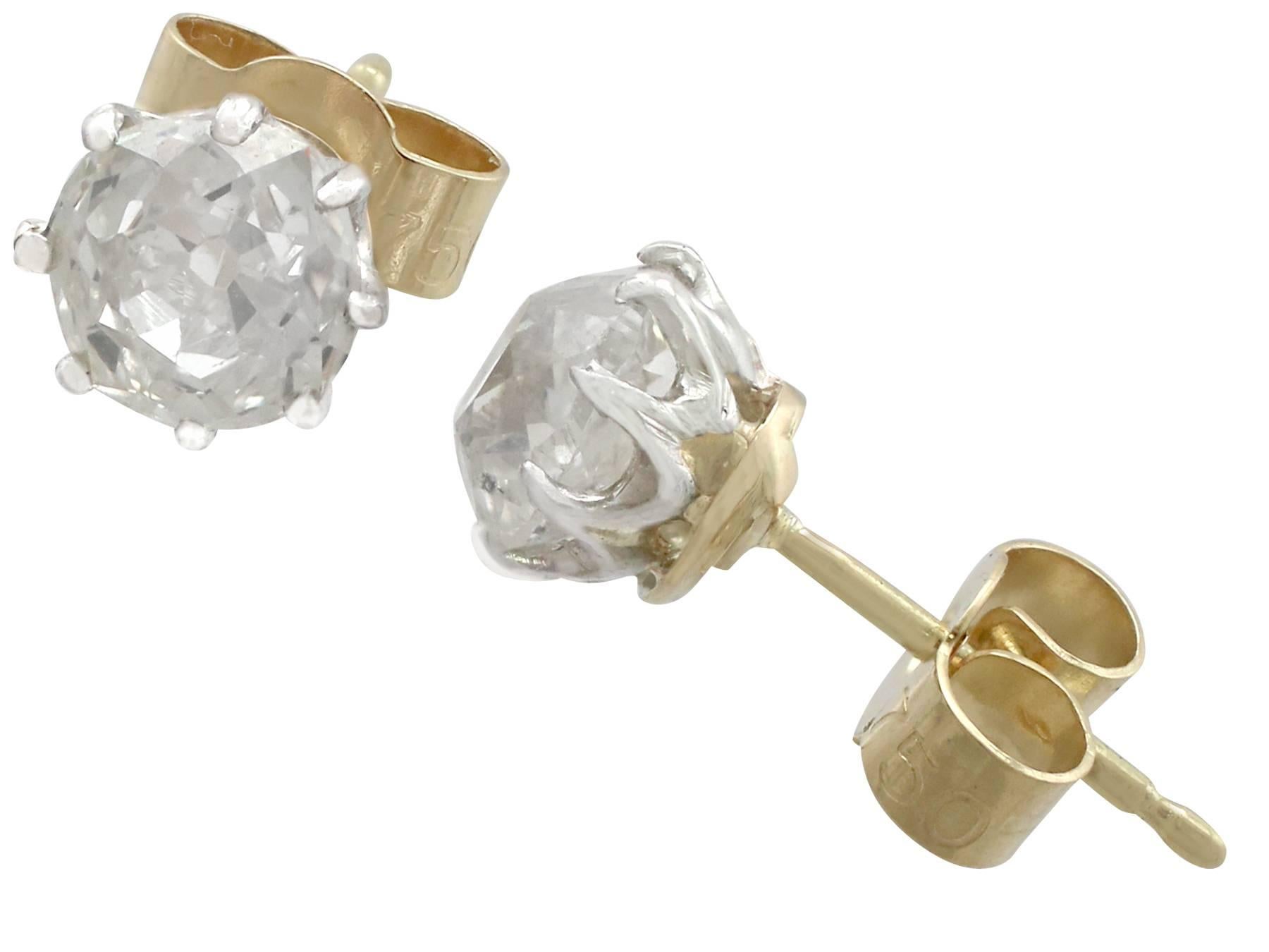 An impressive pair of antique 1.78 carat diamond and 18 karat white and yellow gold stud earrings; part of our diverse antique jewellery and estate jewelry collections

These fine and impressive antique diamond studs have been crafted in 18k white