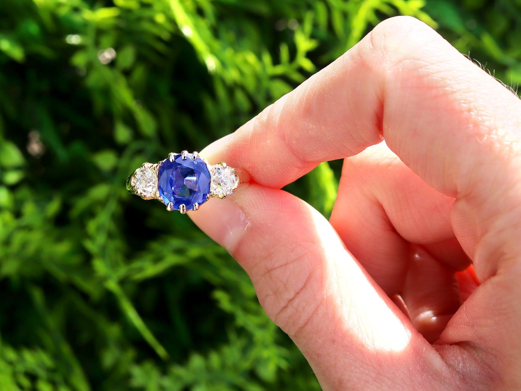 A stunning, fine and impressive antique 2.84 carat Ceylon sapphire and 1.04 carat diamond, 18 karat yellow gold trilogy ring; part of our diverse sapphire ring collections.

This stunning, fine and impressive antique sapphire ring has been crafted