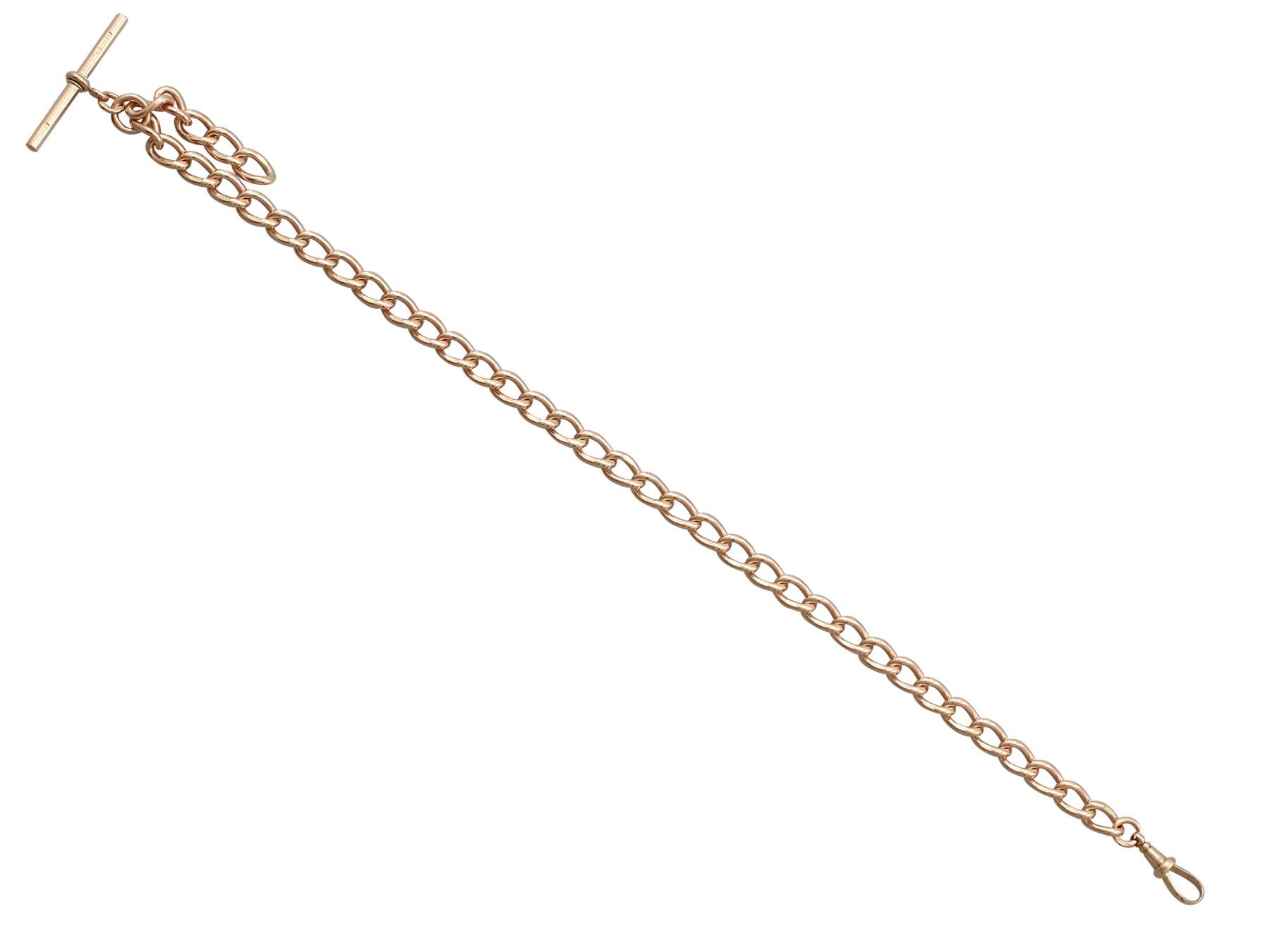 This fine and impressive antique chain has been crafted in 9k rose gold.

The Albert chain is composed of oval curb links, each individually struck with the 9k gold fineness mark (9.375).

A hallmarked T-bar suspends from a rounded jump ring.

The